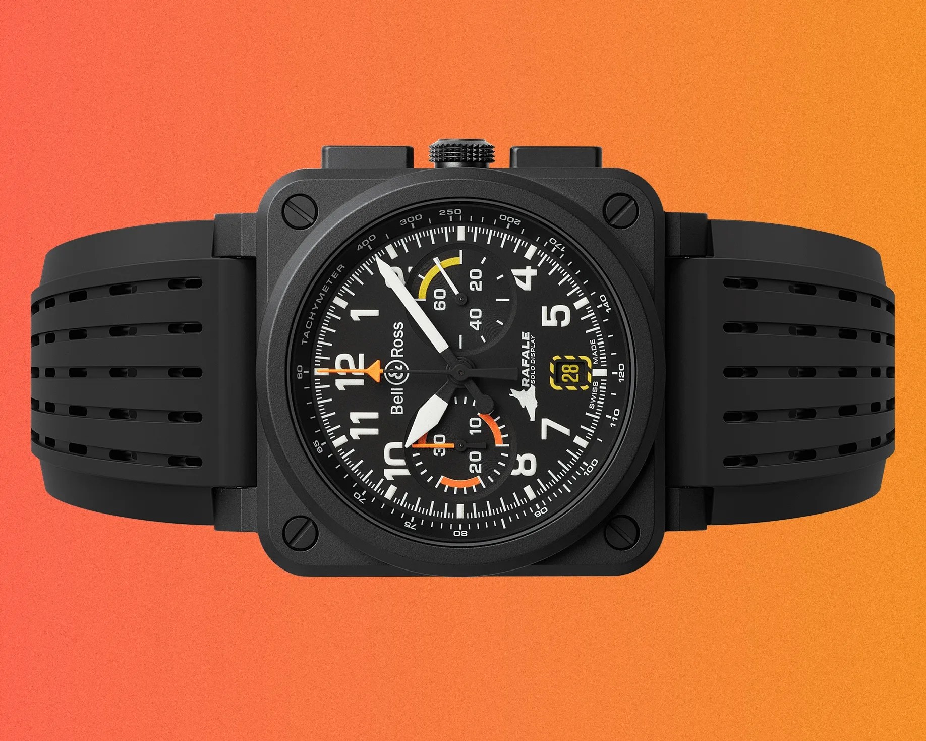 Black Bell & Ross wristwatch with a square case and round dial featuring white numerals and hands, orange and yellow accents, two subdials, a date display at 4 o'clock, and a black perforated rubber strap. The dial includes the text "Bell & Ross," "RAFALE," "SOLO DISPLAY," and "SWISS MADE.
