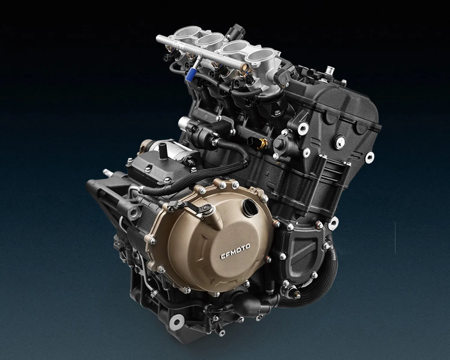 A detailed view of a CFMOTO motorcycle engine, featuring a black and metallic design with visible intake ports, bolts, and wiring. The engine casing has a bronze-colored cover with the CFMOTO logo prominently displayed.