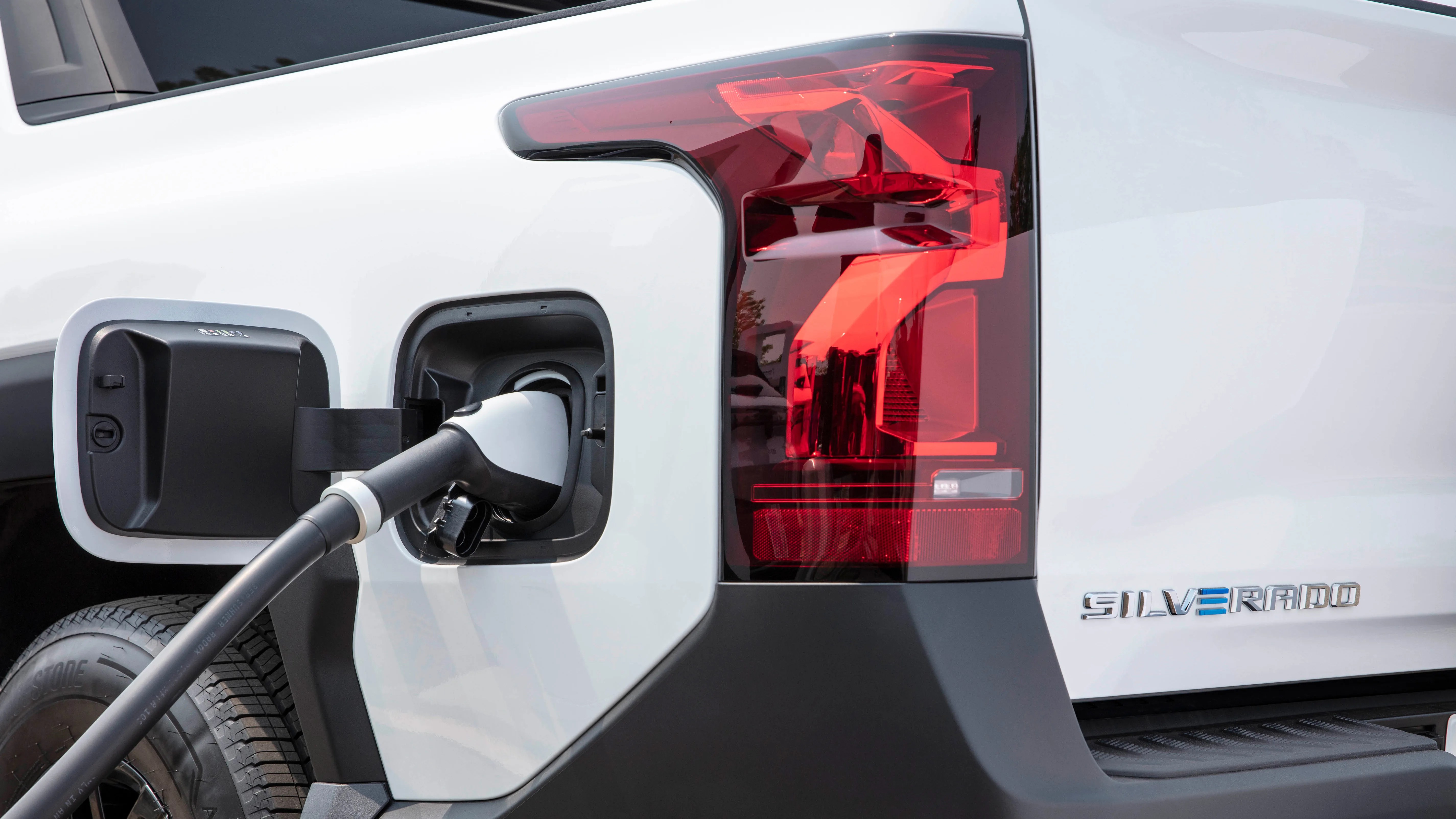 a close-up of a silverado EV charger and badge