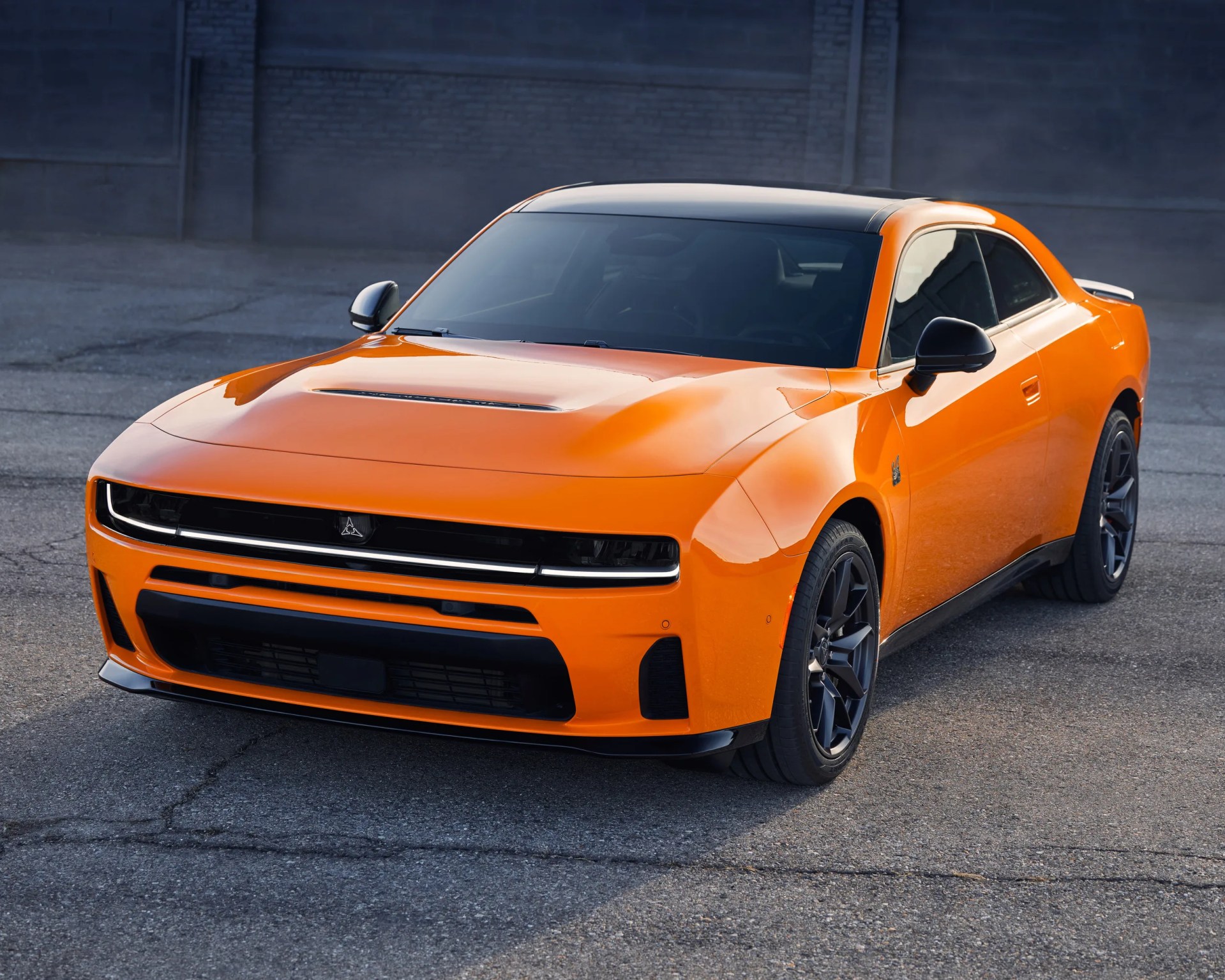 a photo of an orange dodge muscle car