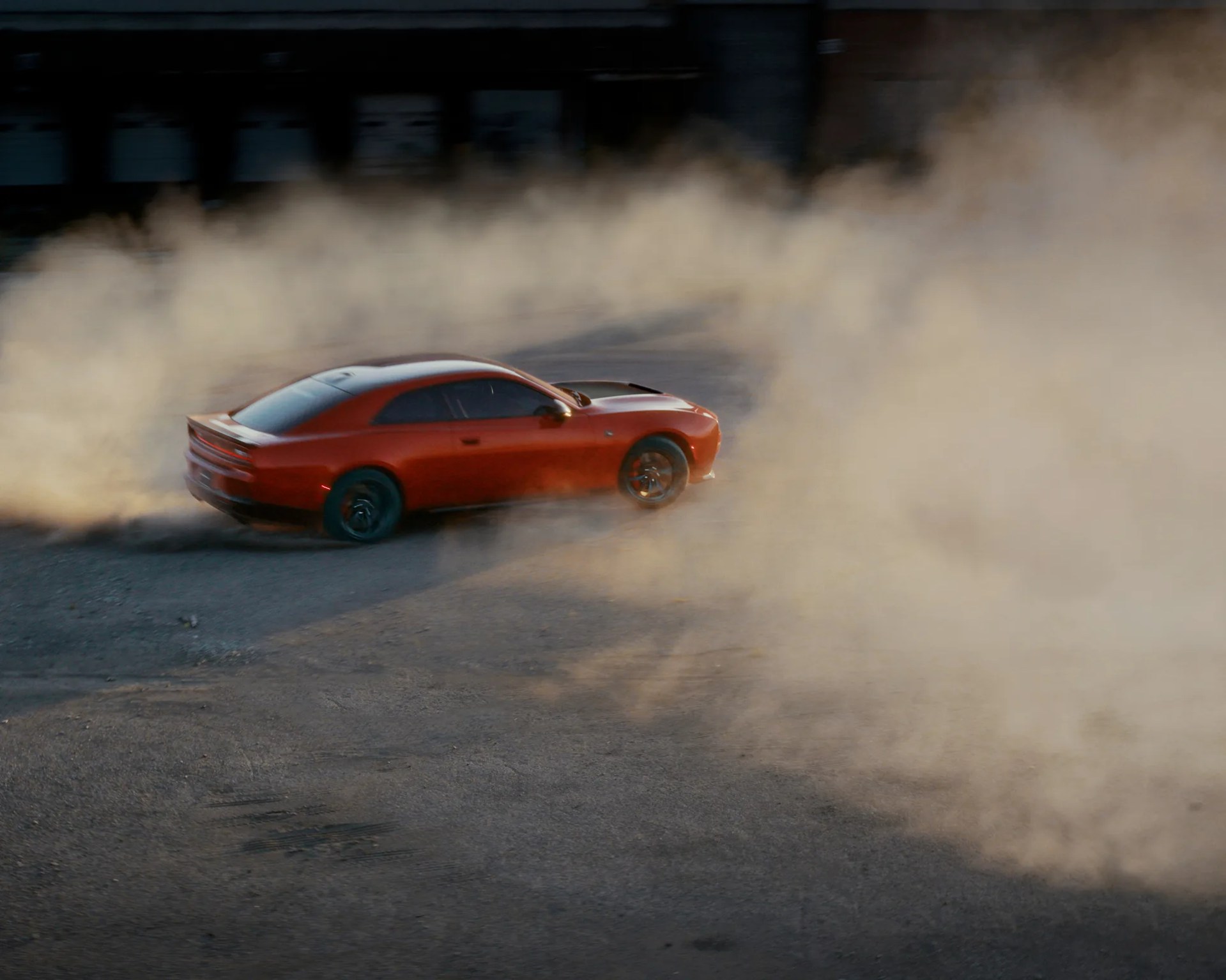 a photo of a dodge muscle car doing a burnout
