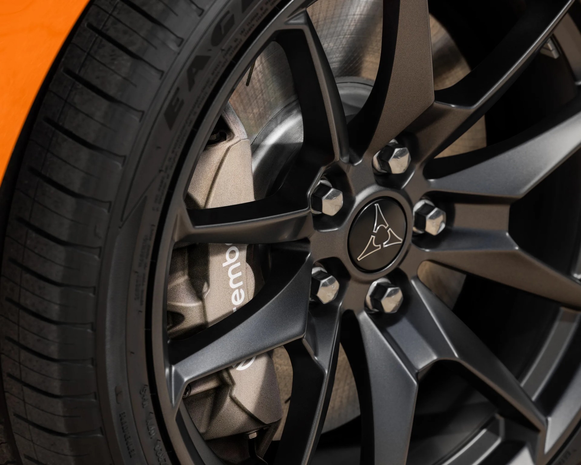 a close-up photo of a dodge muscle car wheel