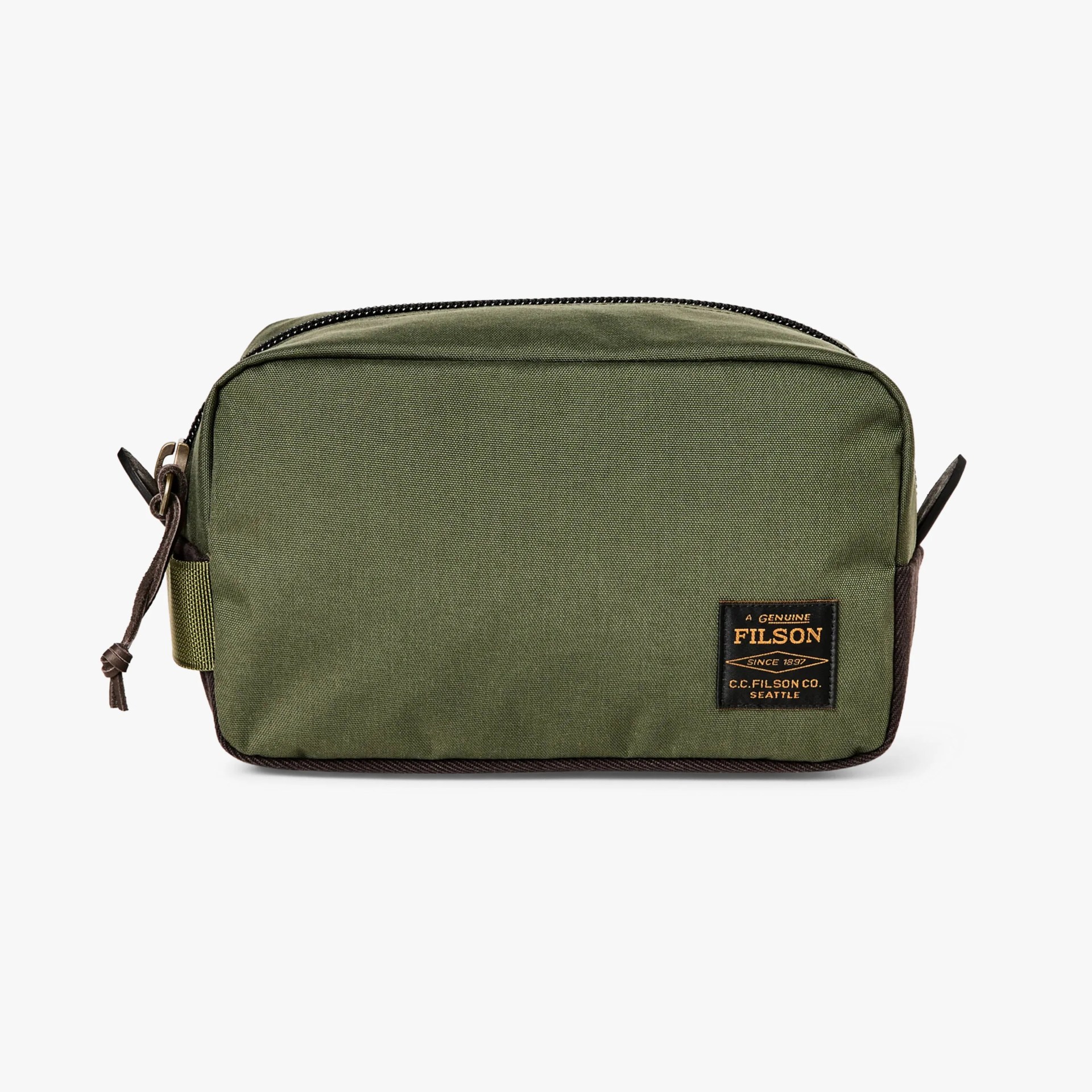 Green rectangular toiletry bag with a black zipper on top, brown accents on the bottom and sides, and a black and orange Filson logo patch on the front lower right corner.