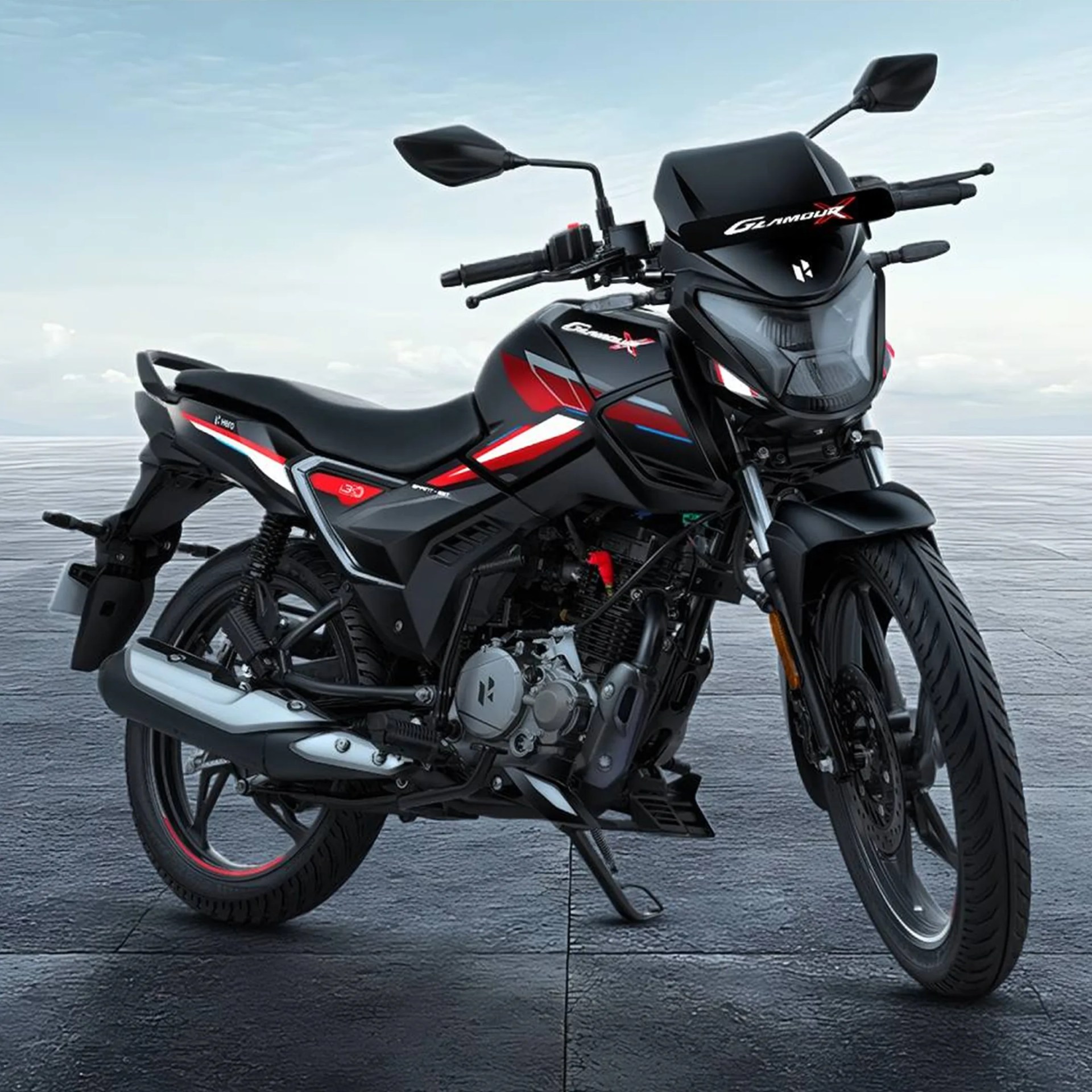 Black and red Hero Glamour X motorcycle with sporty decals, front disc brake, rear suspension springs, and a sleek aerodynamic design.