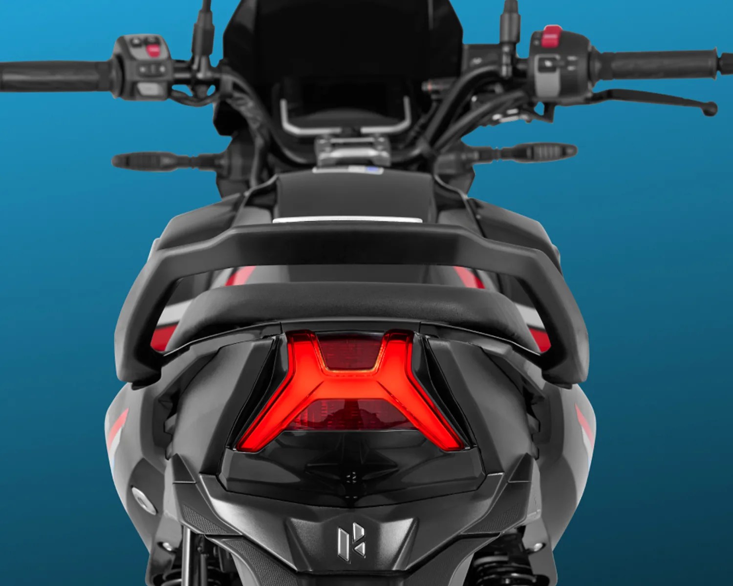 Rear view of a black motorcycle featuring a distinctive red X-shaped tail light, black grab handles, and handlebars with control switches against a blue background.