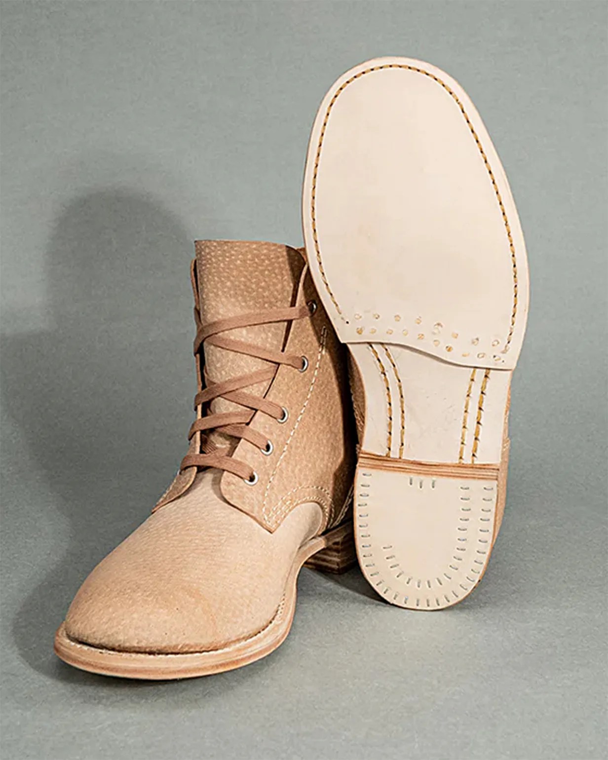 a pair of tan John Lofgren boots