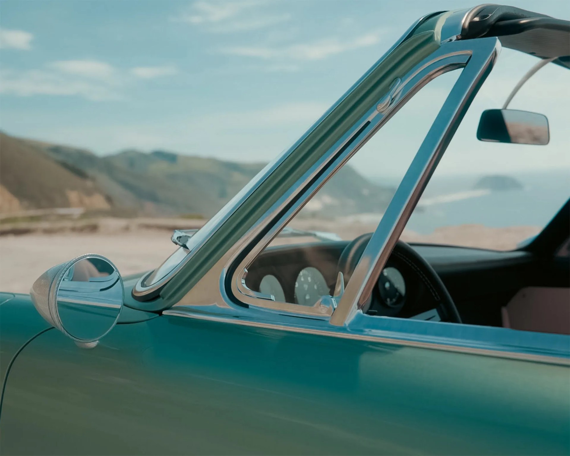 a close-up of a porsche 912 targa restomod