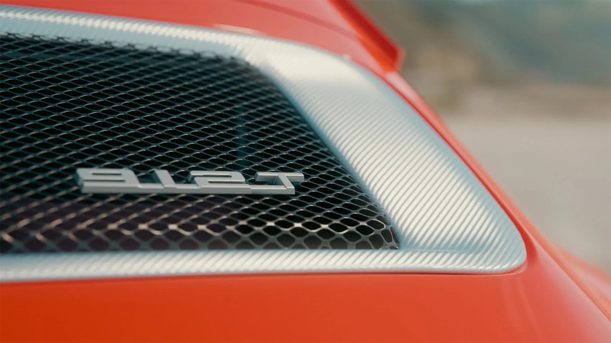 a close-up of a porsche 912 badge
