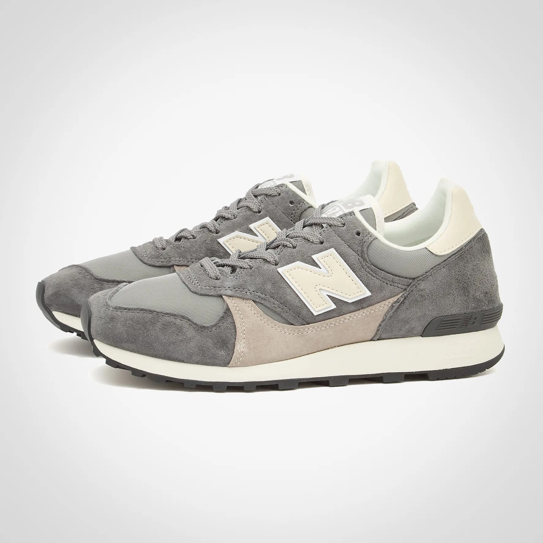 a pair of new balance 475 sneakers