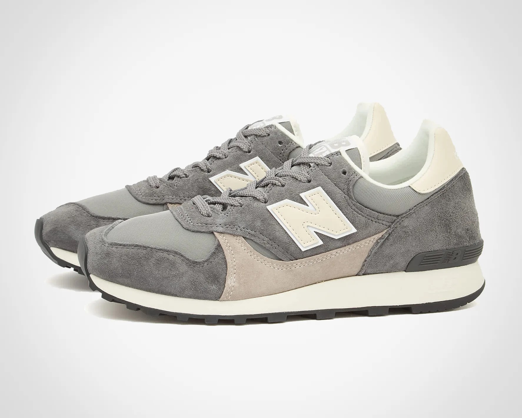 a pair of gray new balance sneakers