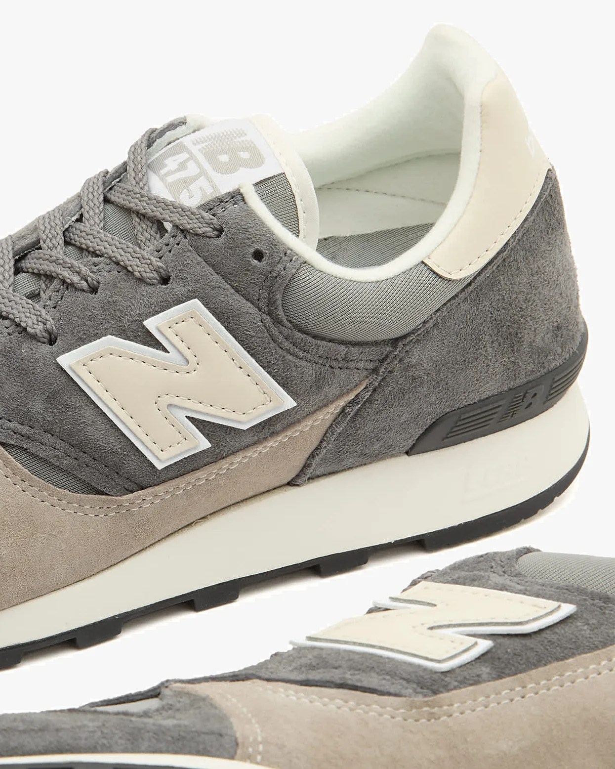 a pair of new balance sneakers