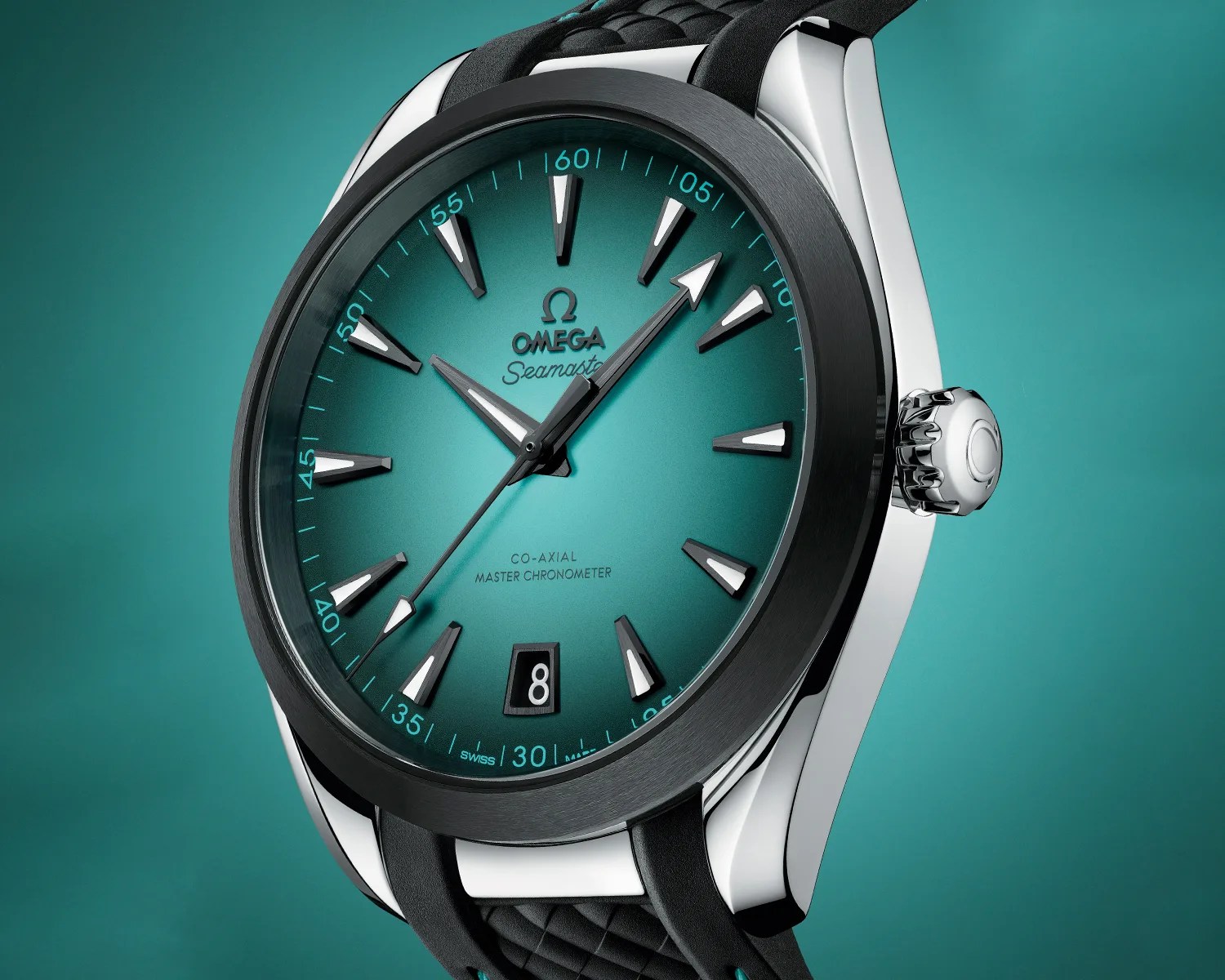 Omega Seamaster wristwatch with a teal gradient dial, black bezel, and silver hour markers. The watch features a date window at 6 o'clock, a black rubber strap, and the text "Co-Axial Master Chronometer" on the dial. The hands are silver with white accents, and the second hand has a white arrow tip.