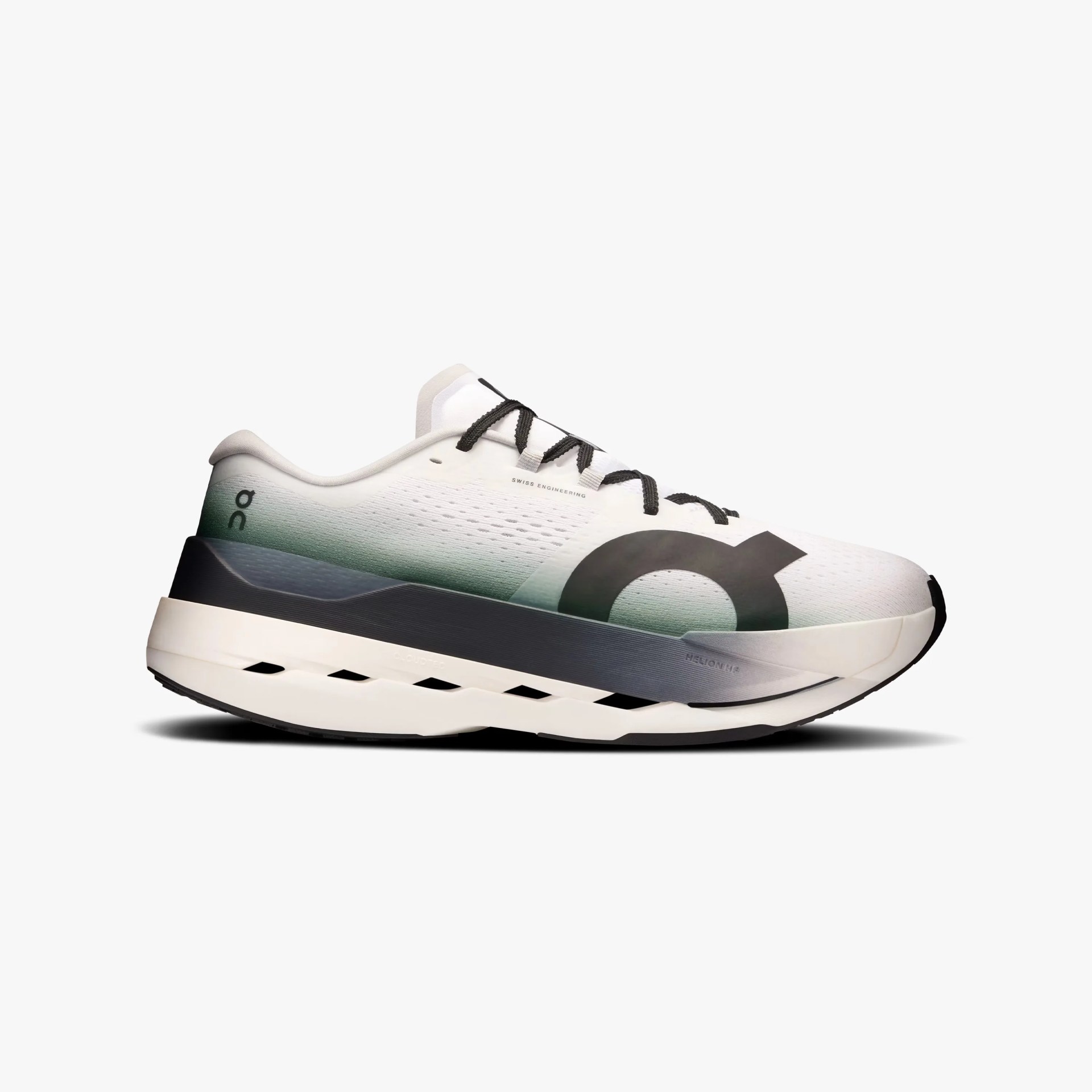 White and green gradient running shoe with black laces, a thick white and gray sole, and a large black circular logo on the side.