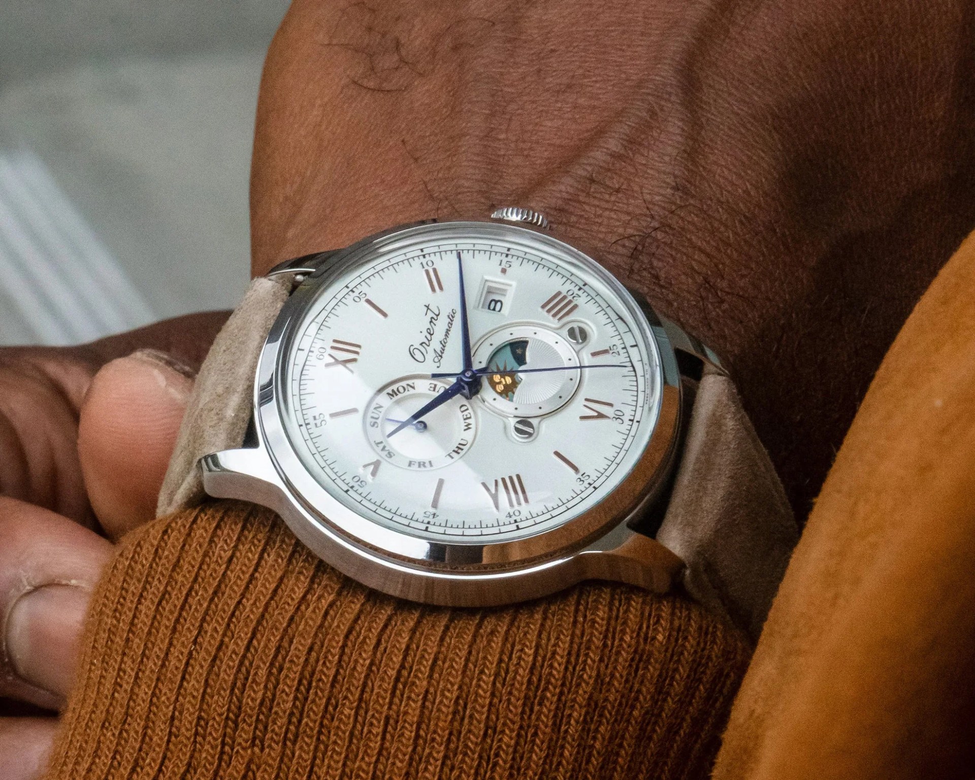 a man wearing an Orient moon phase watch