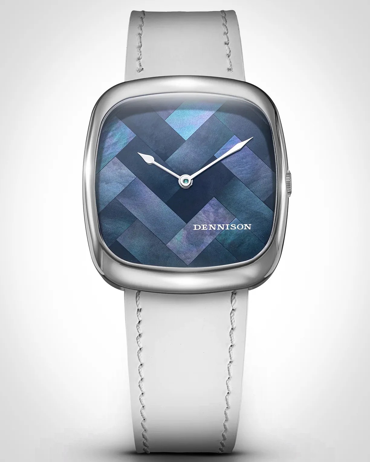 Square silver watch with a blue iridescent herringbone-patterned dial, white hour and minute hands, and the brand name "DENNISON" printed in white. The watch has a white leather strap with visible stitching.