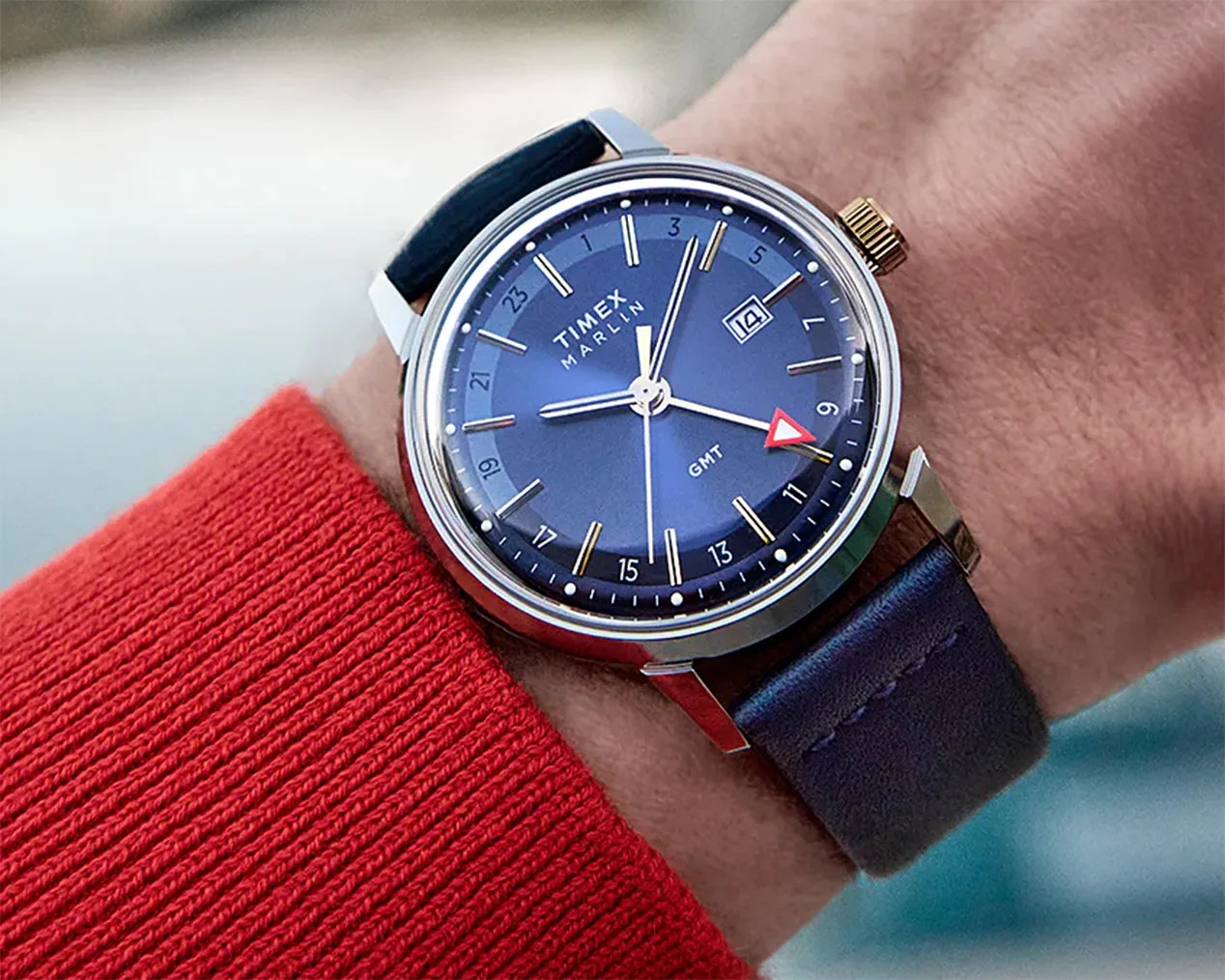 a blue Timex gmt watch on a man's wrist