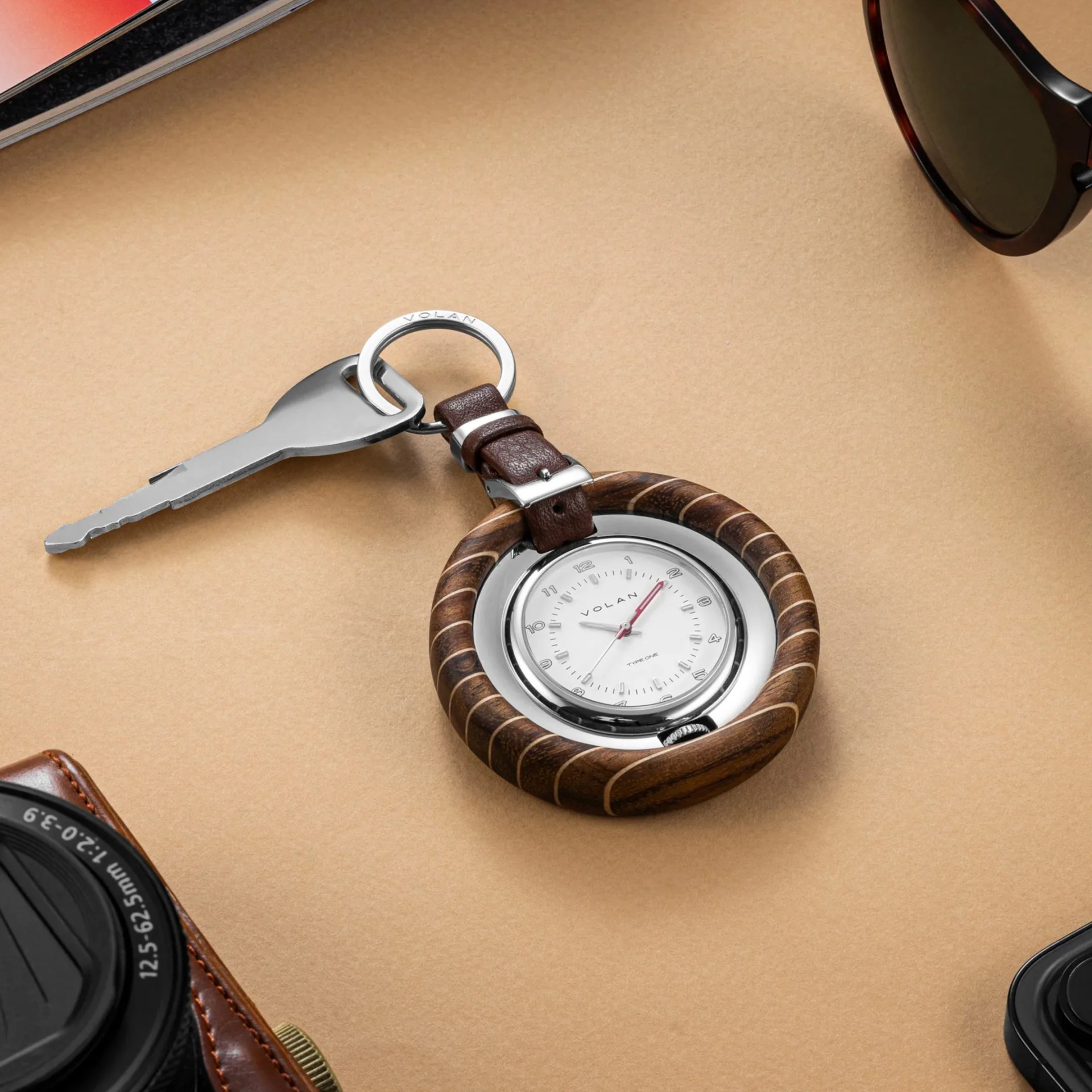 a volan keyring watch attached to a key