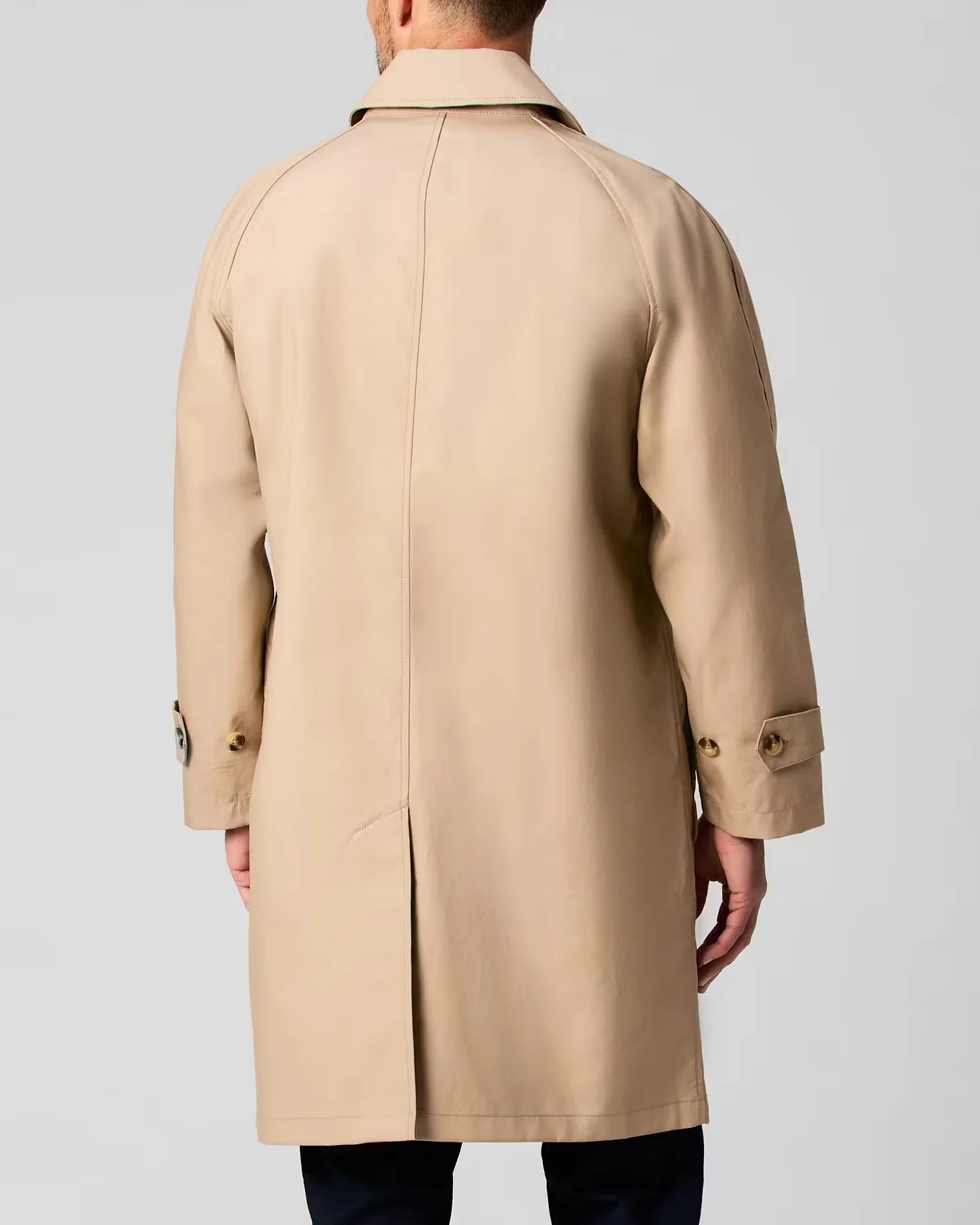 the back of a man in a Wills trench coat