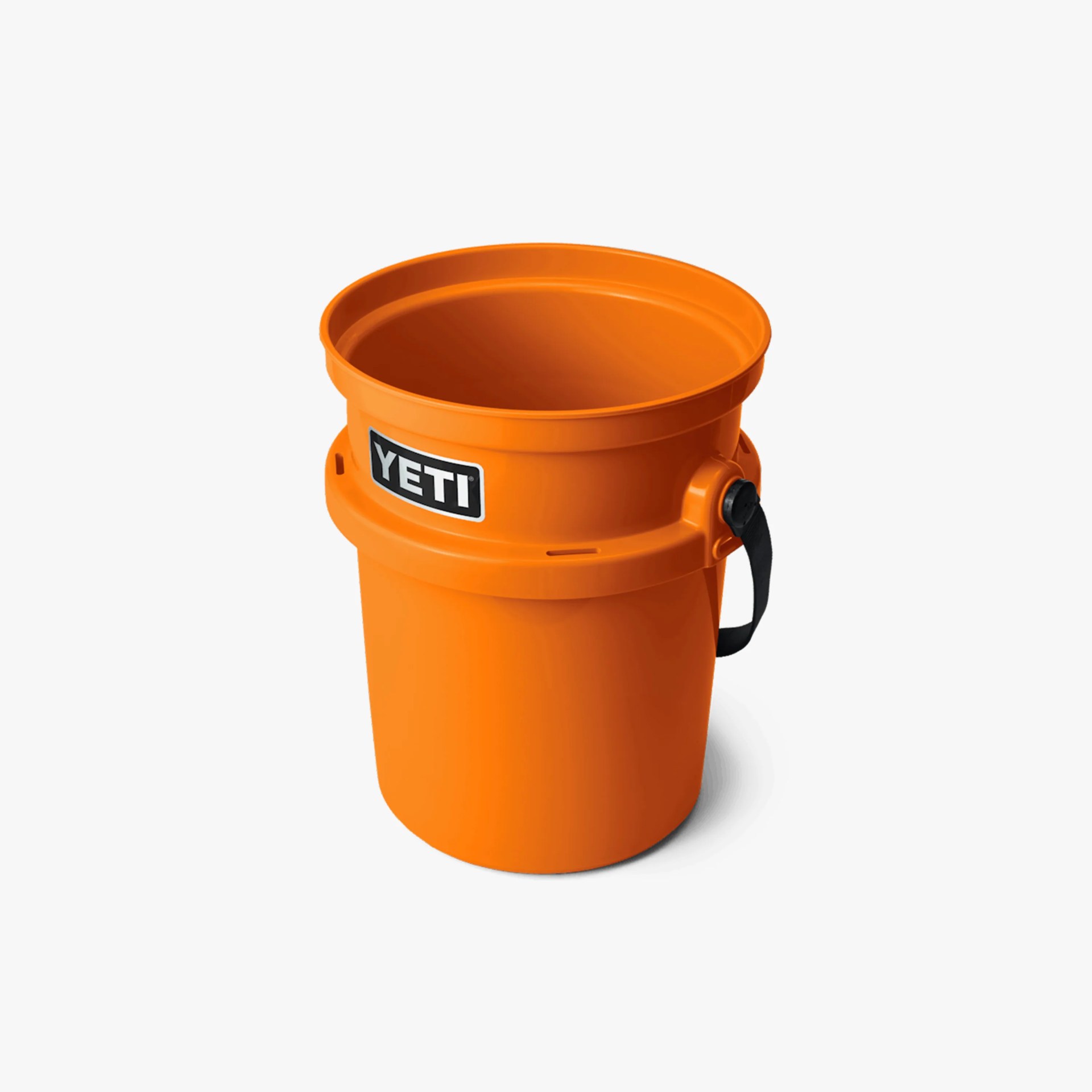 Orange YETI bucket with a black handle attached to the side, featuring a black and white YETI logo on the front.