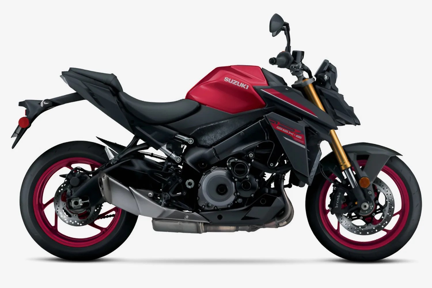 Sporty Suzuki motorcycle with a red fuel tank, black body, and red rims, featuring a sleek, aggressive design and gold front forks.