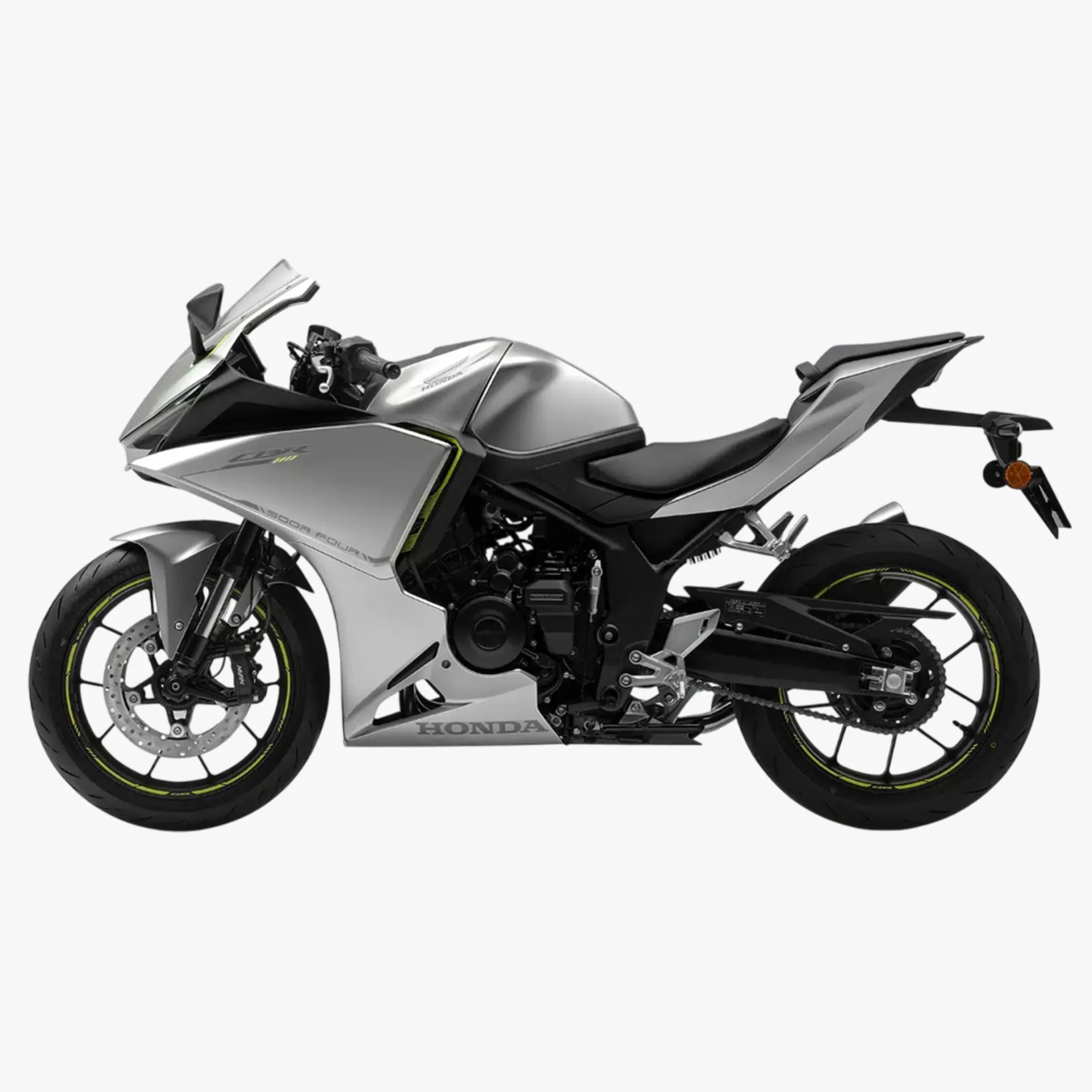 Silver Honda CBR 500R sport motorcycle with black accents, aerodynamic fairings, and neon yellow rim stripes on black wheels.