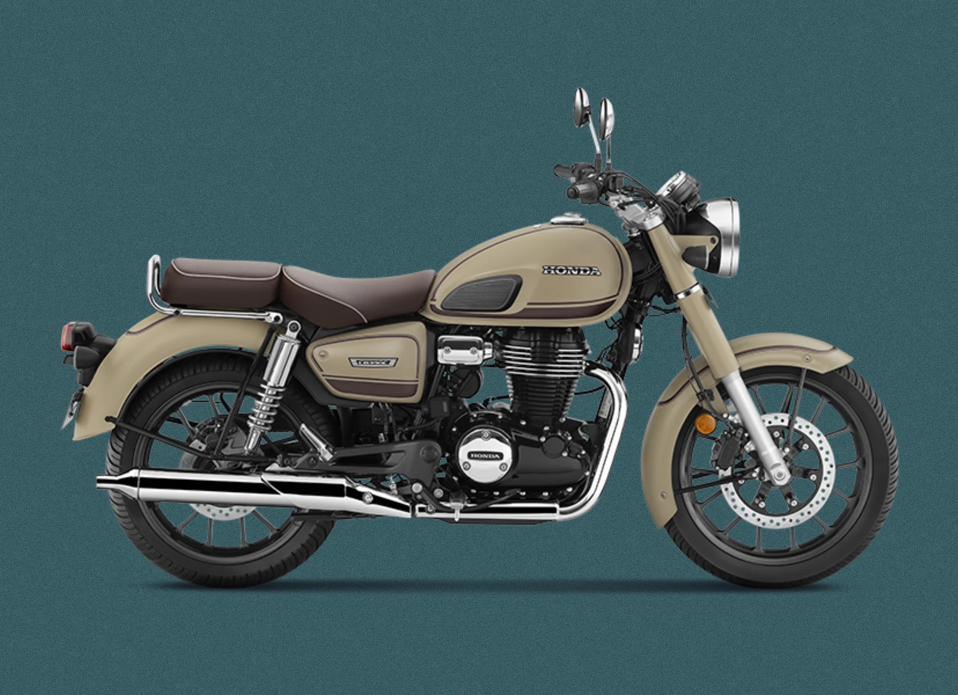Classic-style beige Honda motorcycle with brown seat, chrome exhaust, and black wheels, shown from the right side on a teal background.