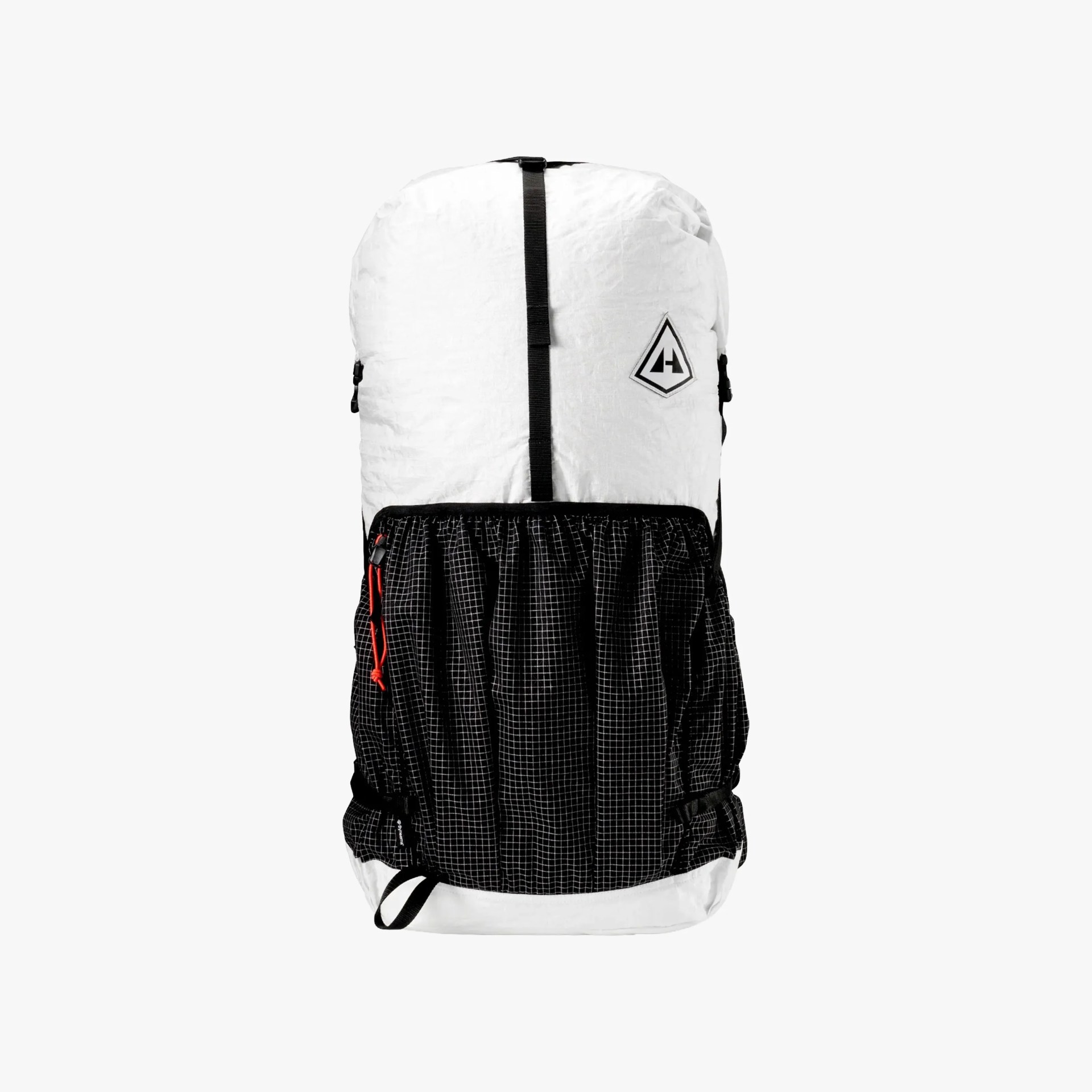 A white and black backpack with a large black front pocket featuring a grid pattern and a red zipper pull. The backpack has a vertical black strap running down the center and a diamond-shaped logo on the upper right front. The bottom and sides of the backpack are white, matching the top section.