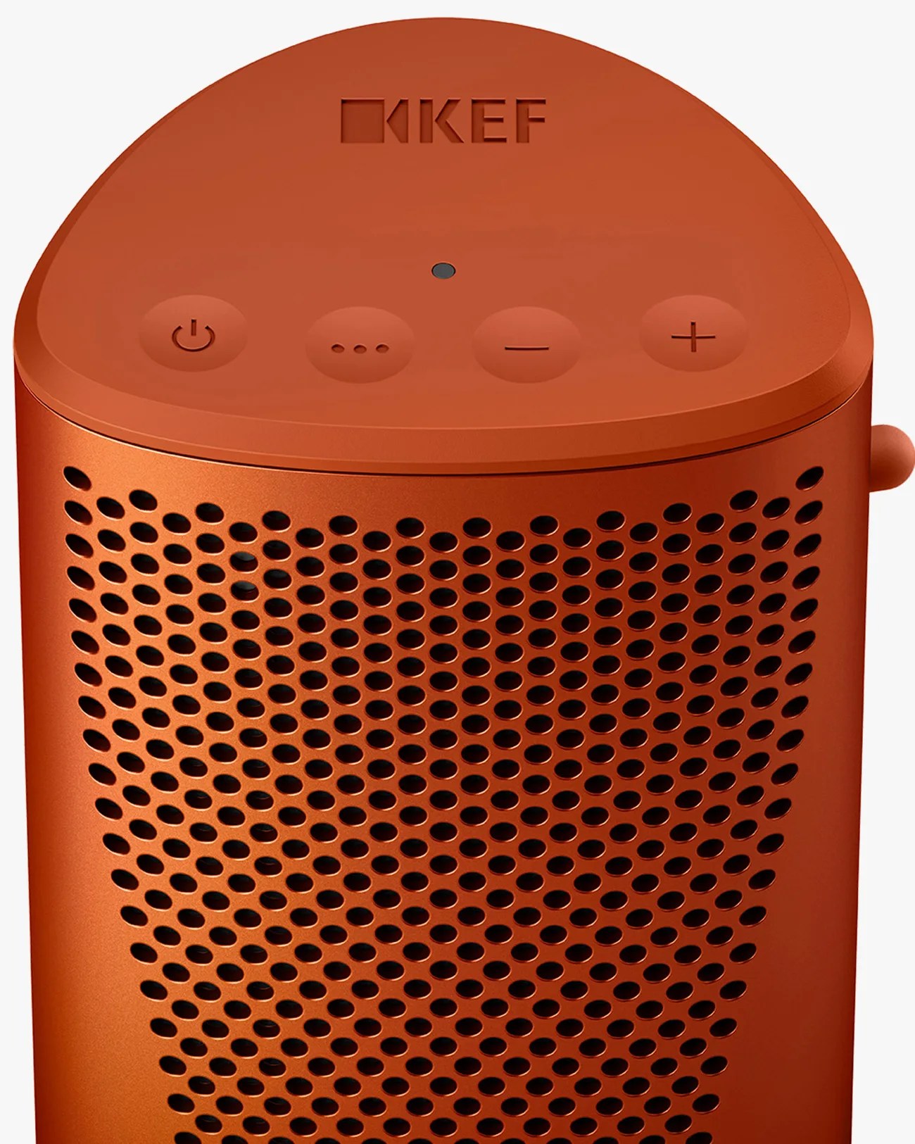 Orange KEF portable Bluetooth speaker with a perforated front grille, featuring four buttons on the top: power, multi-function, volume down, and volume up. The KEF logo is embossed above the buttons.