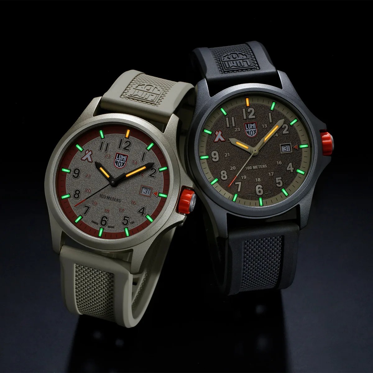 Two Luminox wristwatches with textured dials, one with a beige strap and one with a black strap, both showing glowing hour markers.