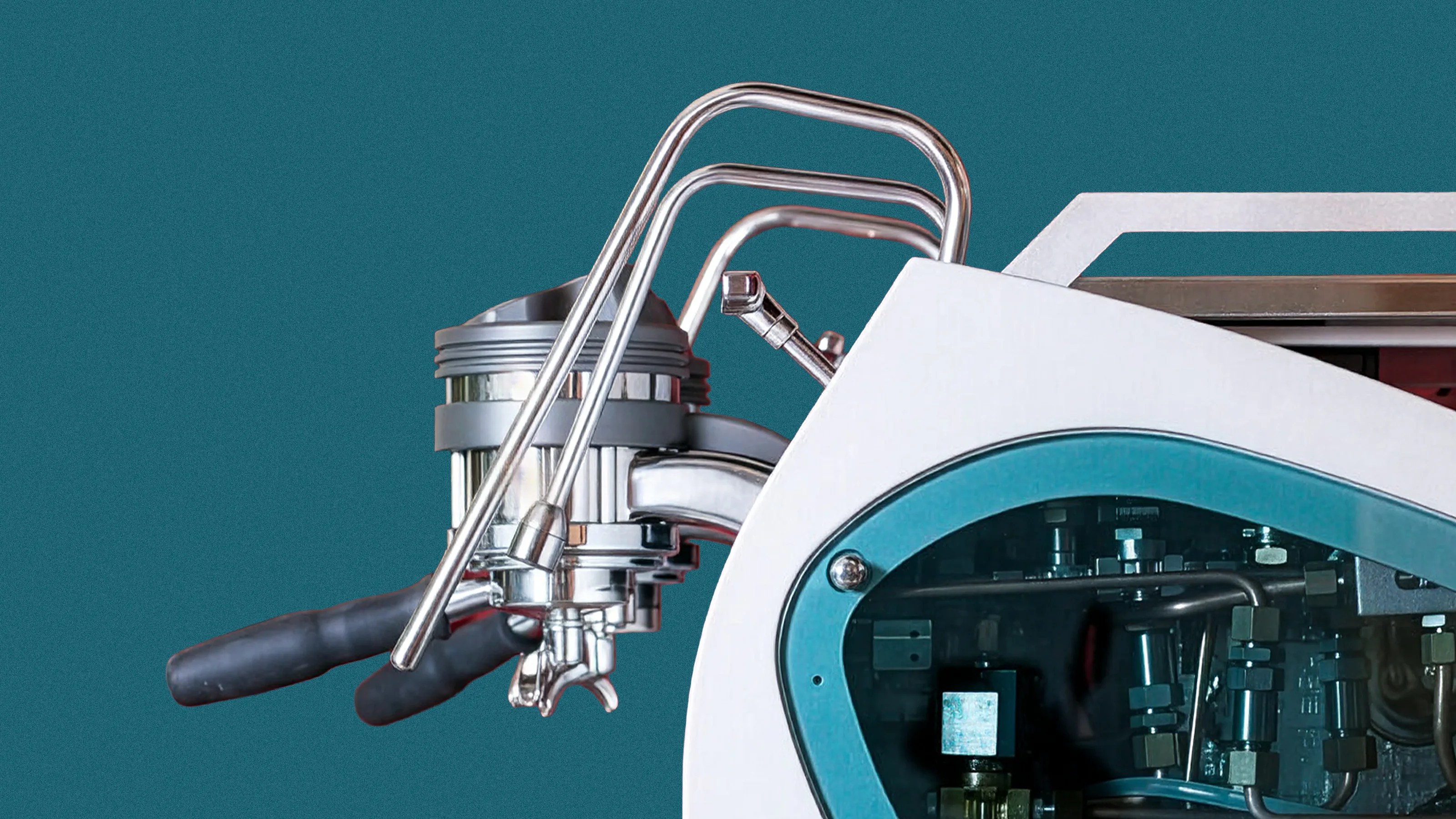 Close-up of a modern espresso machine group head with dual portafilters, chrome steam wands, and a partially visible internal mechanism through a blue-tinted window on the white machine body.