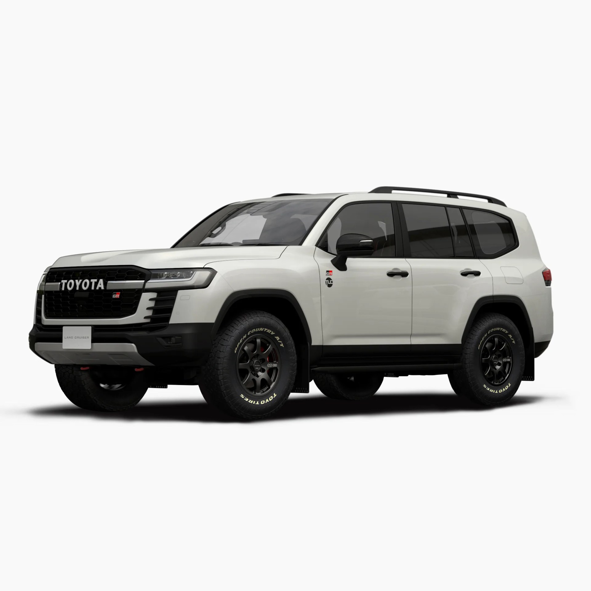 White Toyota Land Cruiser SUV with black accents, black grille featuring "TOYOTA" lettering, black roof rails, tinted windows, and black off-road tires with white lettering. The vehicle has a rugged, modern design with a sporty appearance.