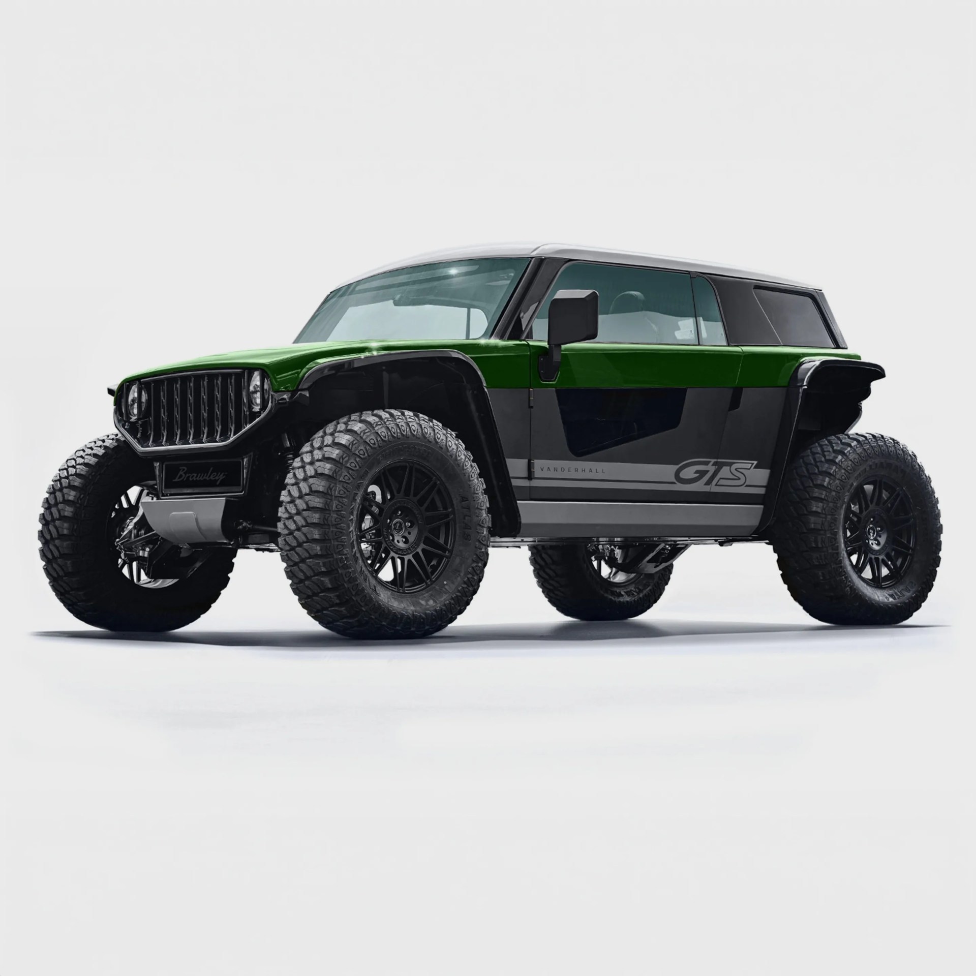 A rugged off-road vehicle with large, knobby tires and a two-tone body featuring a green upper section and black lower section. The vehicle has a boxy, muscular design with a prominent front grille, black side mirrors, and tinted windows. The side of the vehicle displays the text "VANDERHALL GTS" in gray. The roof is white, contrasting with the darker body colors. The overall look is aggressive and built for tough terrain.