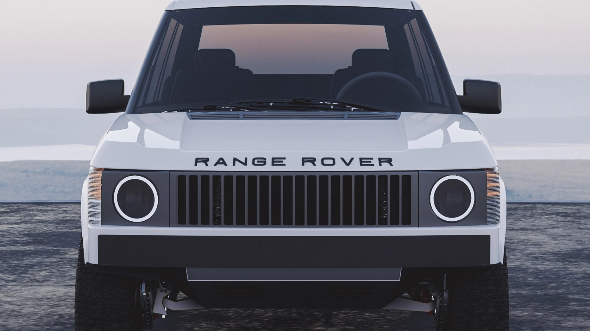 Front view of a white Range Rover with a modern, minimalist design featuring round LED headlights, a black vertical slat grille, and black side mirrors. The vehicle has a clean, boxy shape with the "RANGE ROVER" lettering prominently displayed on the hood. The windshield is tinted, and the tires are rugged, suitable for off-road driving.