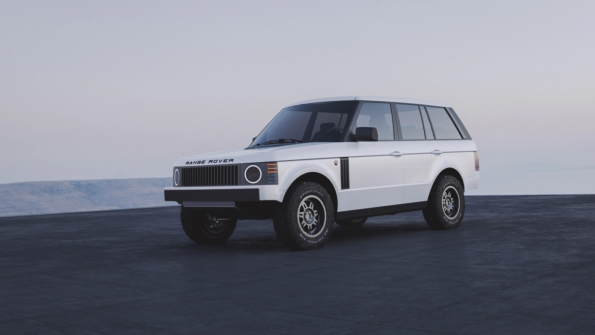 White Range Rover SUV with a boxy, retro design, black grille, circular headlights, and off-road tires, parked on a dark paved surface with a pale sky background.