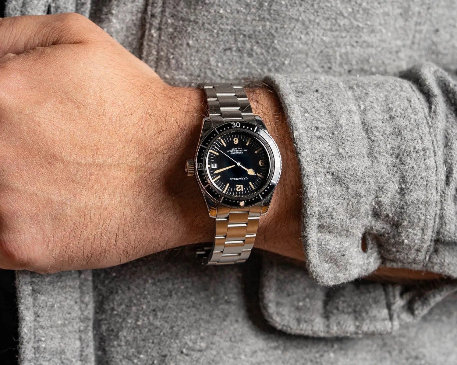 a Caravelle dive watch on a mans wrist
