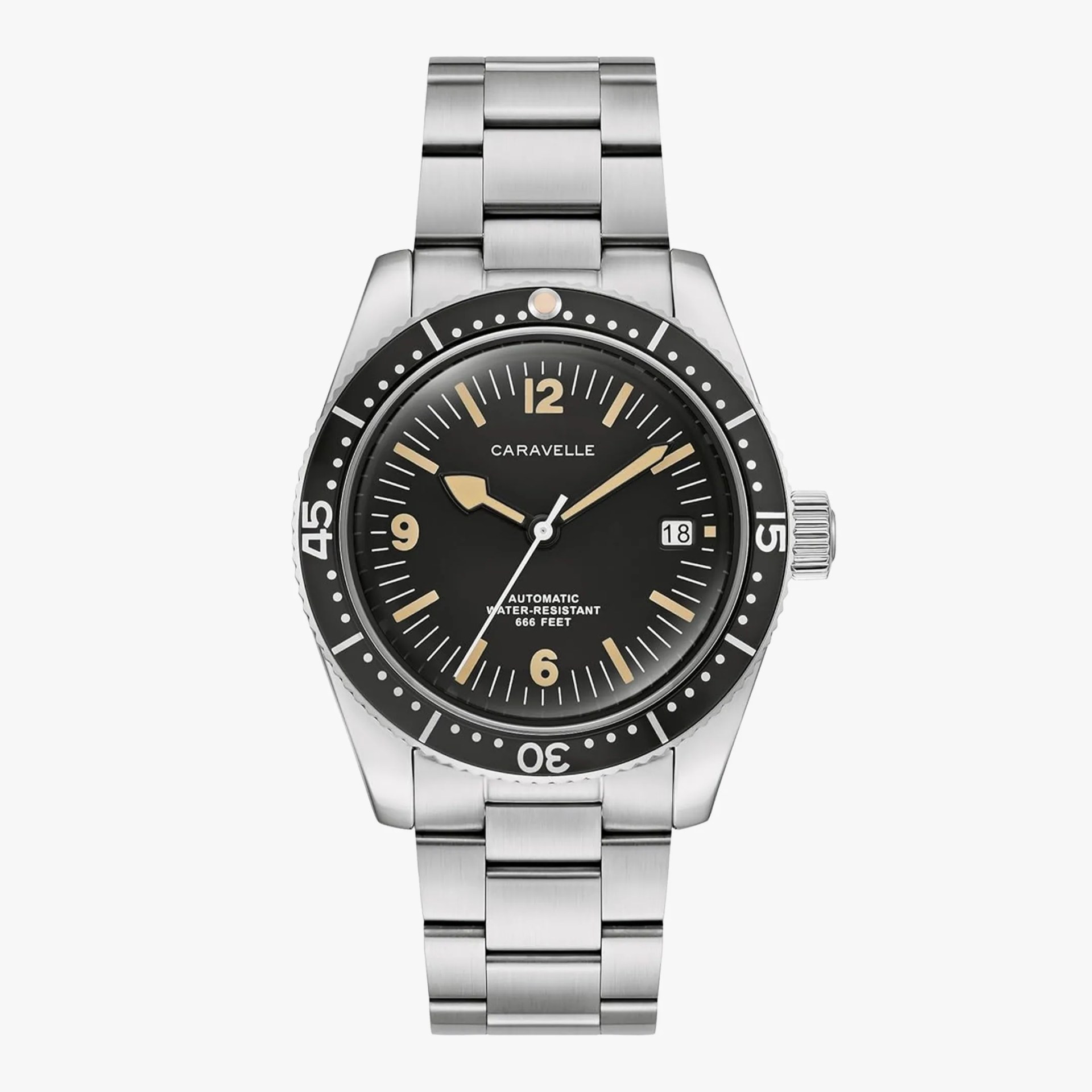 Stainless steel Caravelle wristwatch with a black dial, beige hour markers and hands, a date window at 3 o'clock, and a black rotating bezel marked with white numerals and dots. The watch features a stainless steel link bracelet and is labeled as automatic and water-resistant up to 666 feet.