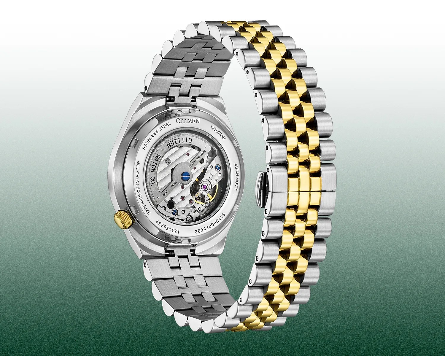 Back view of a Citizen wristwatch with a stainless steel and gold-tone metal bracelet. The watch features a transparent case back revealing the mechanical movement inside. The case back is marked with details including "Citizen," "Stainless Steel," "Sapphire Crystal-Top," "Japan Mov't," and water resistance of 5 bar. The crown is gold-toned, matching the gold links in the bracelet.