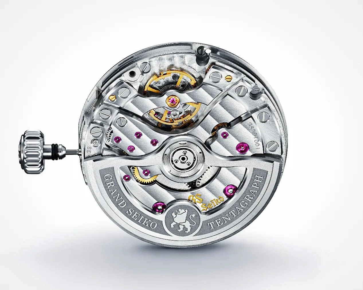 Mechanical watch movement with visible gears, screws, and jewels, featuring a winding crown on the left side. The movement is engraved with "GRAND SEIKO TENTAGRAPH" and includes the Grand Seiko lion emblem. The design showcases polished metal components with gold and purple accents.
