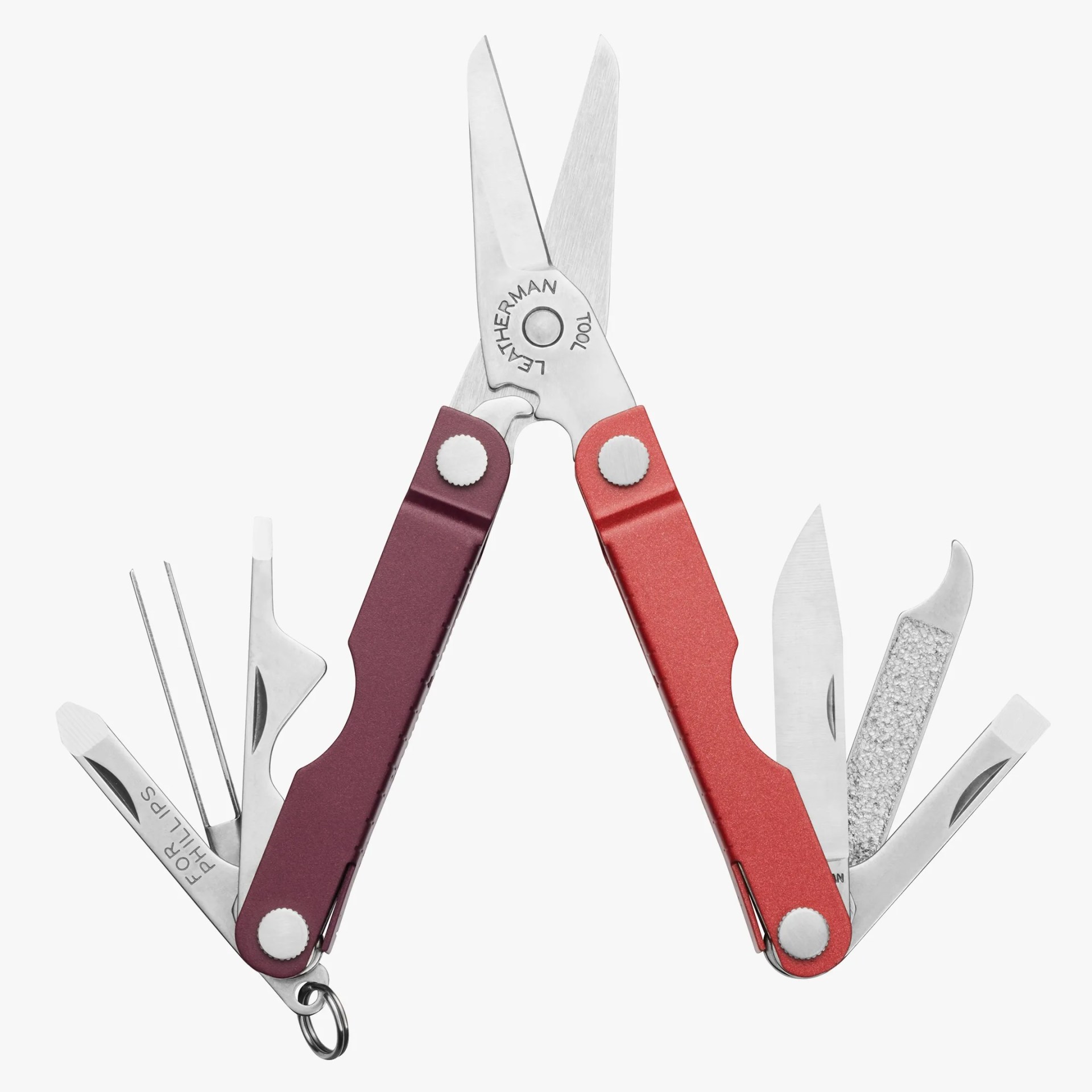 Compact multitool with red and maroon handles, featuring scissors, a knife, a file, tweezers, a small flathead screwdriver, a bottle opener, and a Phillips screwdriver. The tool is open, displaying all its components.