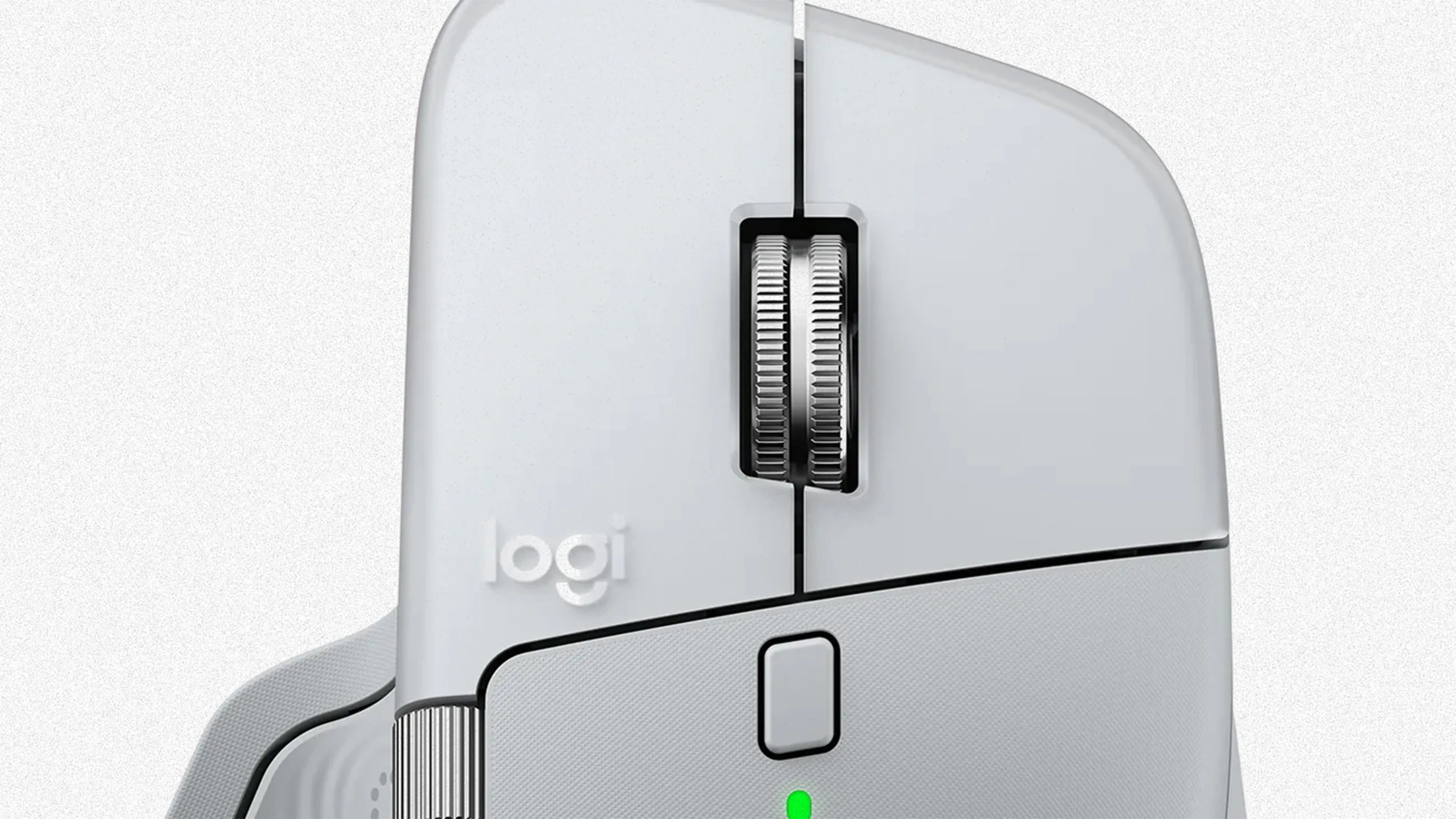 Close-up of a white Logitech computer mouse showing the scroll wheel, a rectangular button below it, and the "logi" logo on the left side. The mouse has a textured grip area and a small green indicator light below the button.