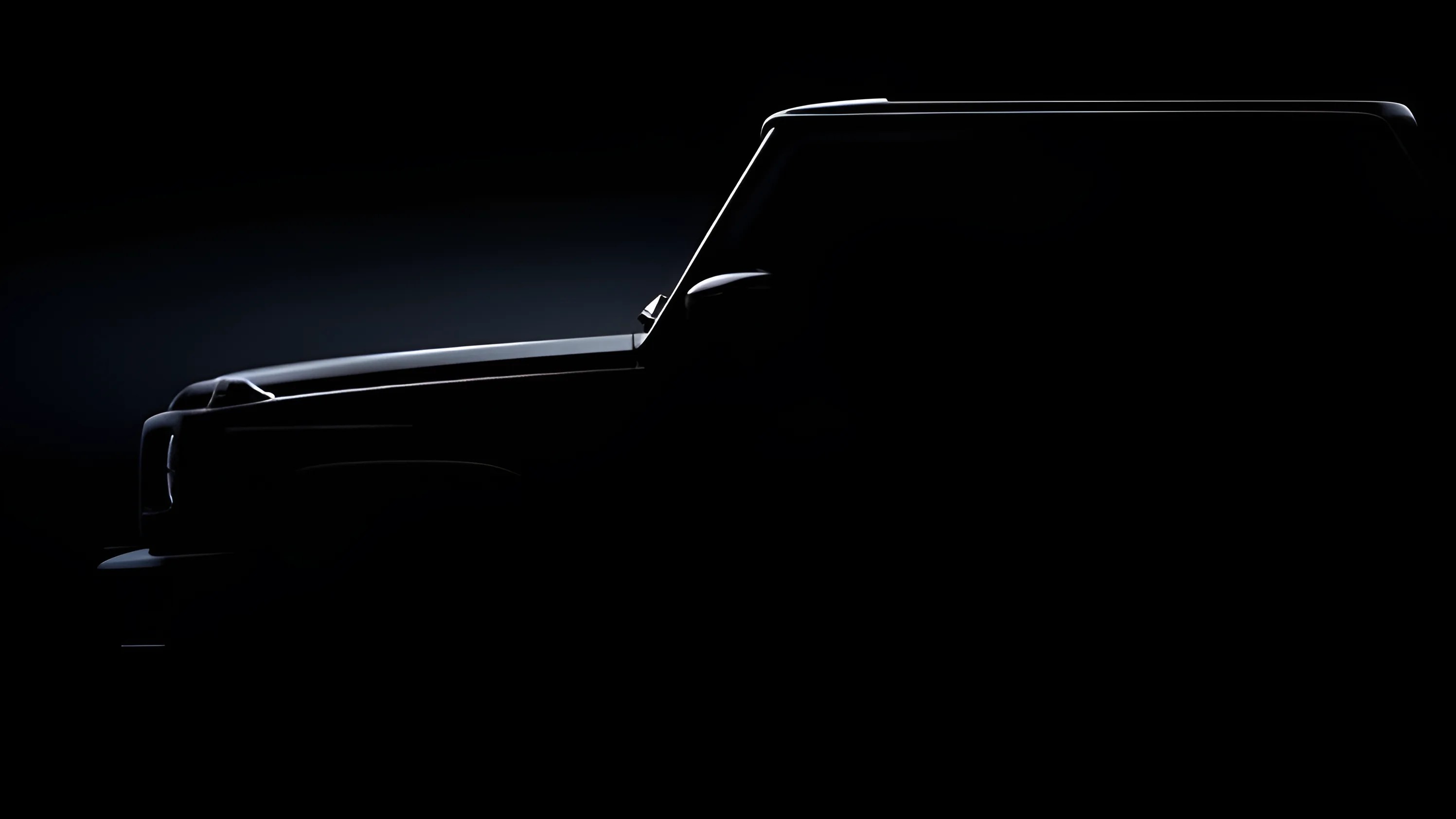 Silhouette of a boxy SUV with a prominent hood and roofline, highlighted by subtle lighting along the edges against a dark background.