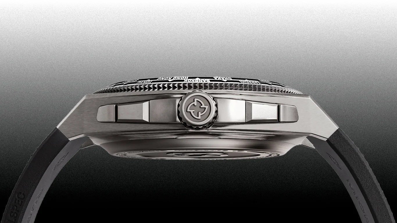 Side view of a Micromilspec wristwatch showing a brushed metal case with a textured crown featuring a cross-like logo. The watch has a black strap attached to the case, and the bezel has a detailed pattern with engraved city names visible on the top edge. The background transitions from white at the top to black at the bottom.