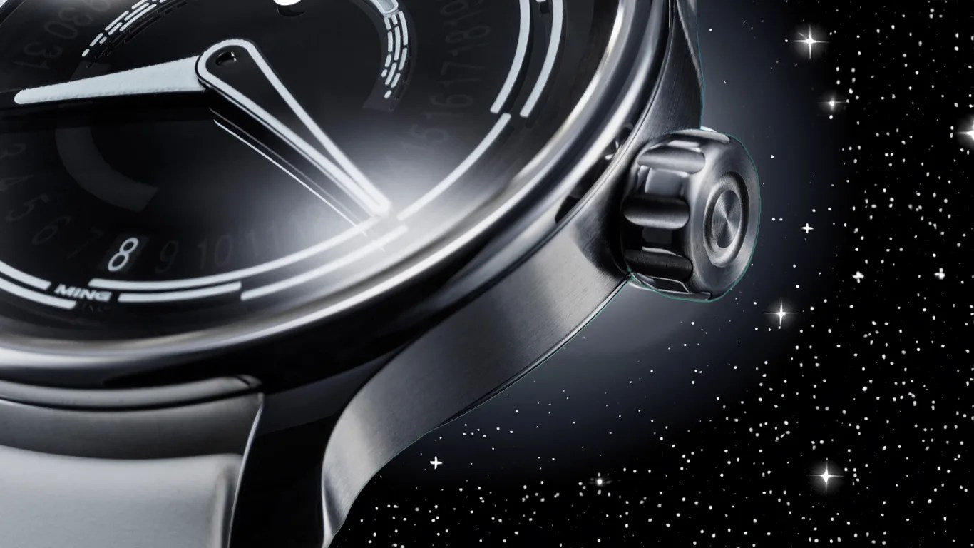 Close-up of a sleek, black MING wristwatch with a brushed metal case and a prominent crown, set against a starry night sky background. The watch face features white markings and hands, with a visible date indicator showing the number 8.