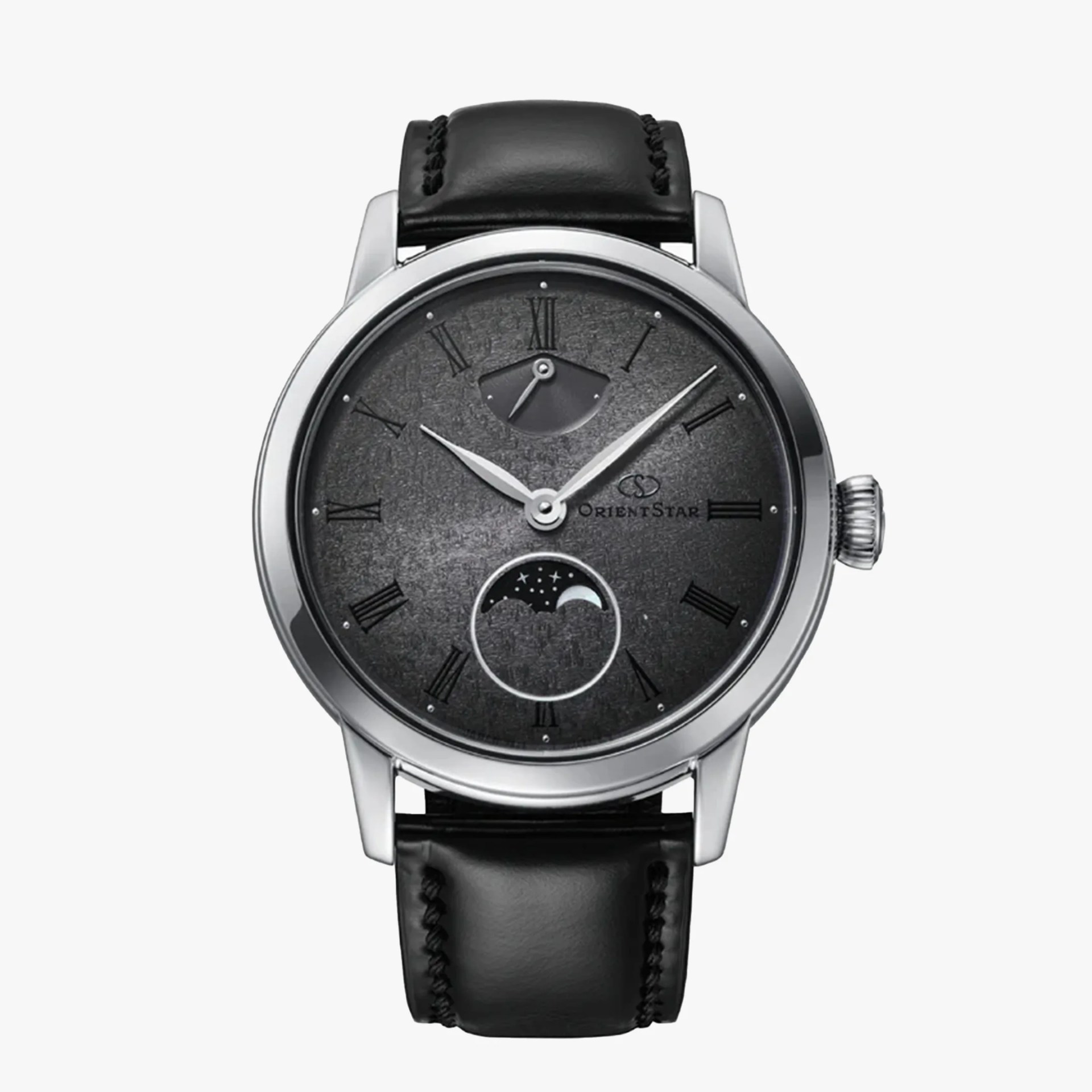 Silver round wristwatch with a textured dark gray dial featuring black Roman numeral hour markers. It has two silver hands for hours and minutes, a power reserve indicator near the 12 o'clock position, and a moon phase subdial above the 6 o'clock position. The watch has a black leather strap with visible stitching. The brand name "Orient Star" is printed on the right side of the dial.