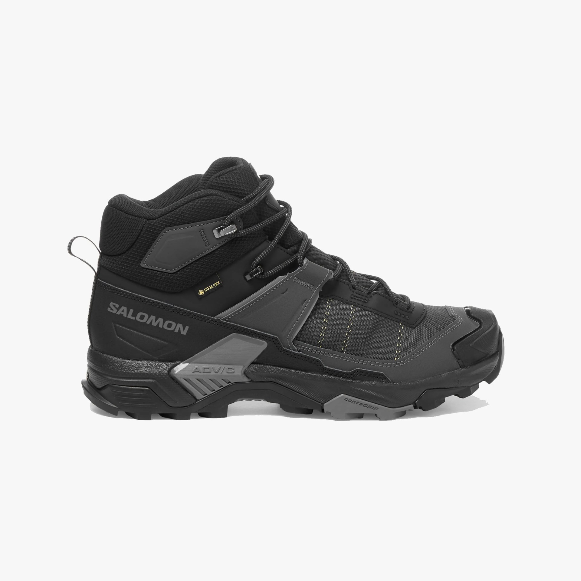 Black and dark gray Salomon hiking boot with a high ankle collar, lace-up closure, and rugged sole. The boot features Gore-Tex waterproof material, reinforced toe, and textured grip outsole designed for outdoor terrain. The Salomon logo is visible on the side, along with "ADV/C" and "Contagrip" branding on the sole.