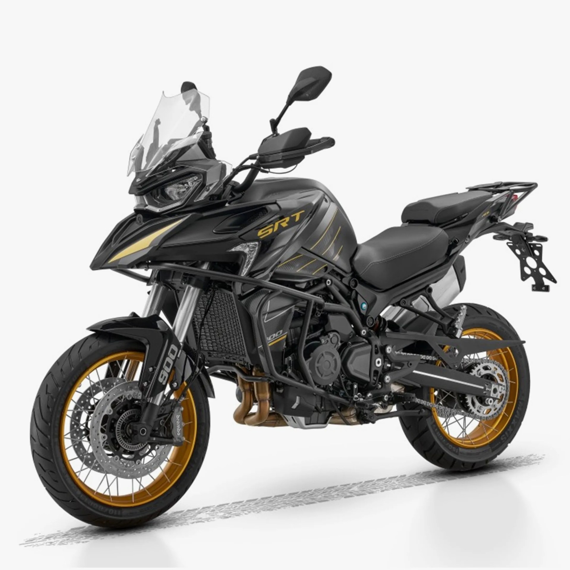 Black and gold adventure motorcycle with a tall windshield, dual front disc brakes, spoked wheels with gold rims, and "SRT" branding on the side. The bike features a rugged frame, off-road tires, and a comfortable two-seat design.