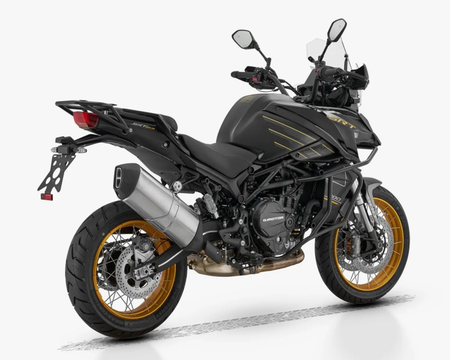 Black adventure motorcycle with gold rims, featuring a large exhaust pipe, dual disc brakes on the front wheel, and protective crash bars around the engine and front fairing. The bike has a raised windshield, side mirrors, and a rear luggage rack. The design includes subtle gold accents on the fuel tank and fairing.