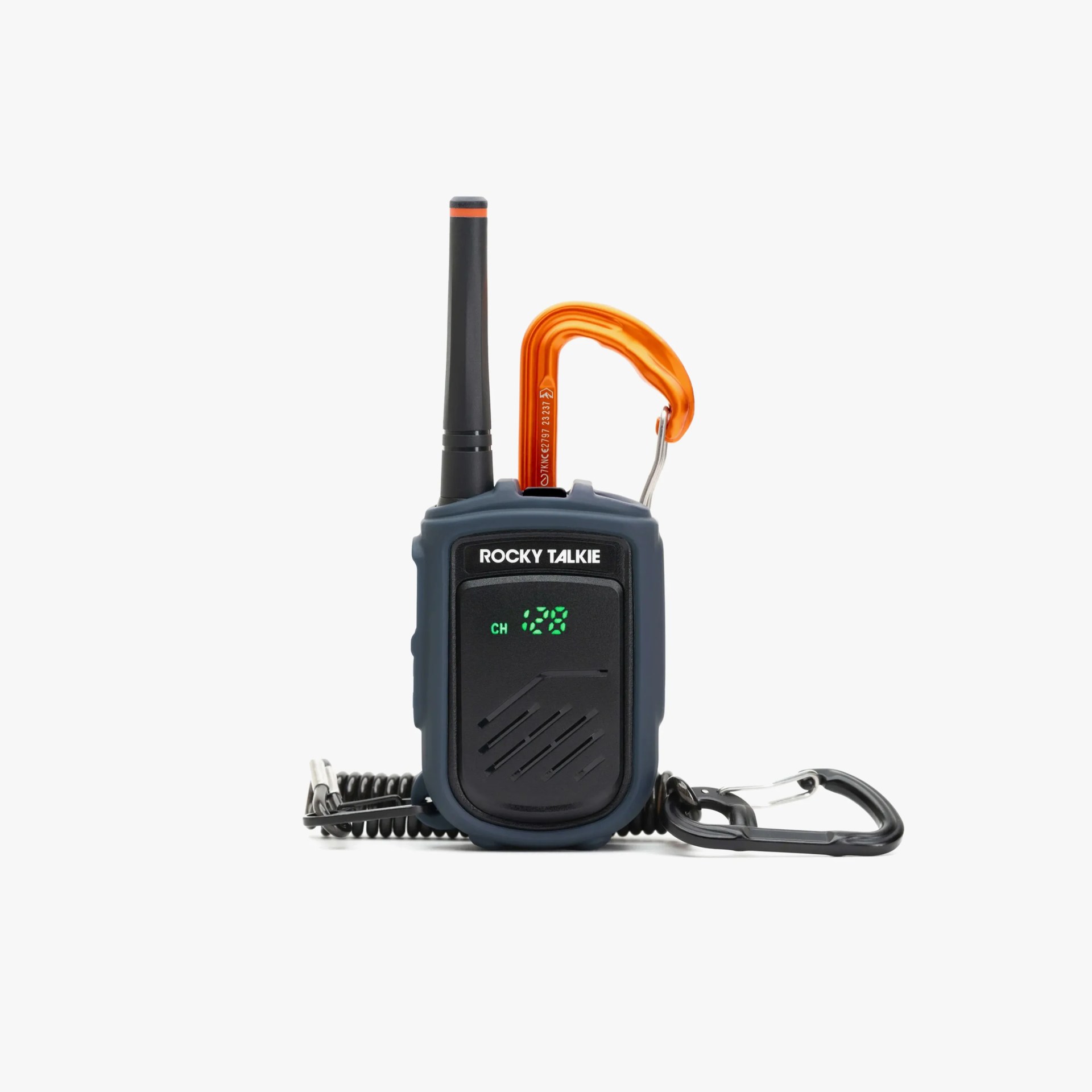 Compact black and dark blue walkie-talkie with a short antenna, an orange carabiner attached at the top, and a black carabiner connected to a coiled cord at the bottom. The front display shows "ROCKY TALKIE" and channel 128 in green digital numbers.
