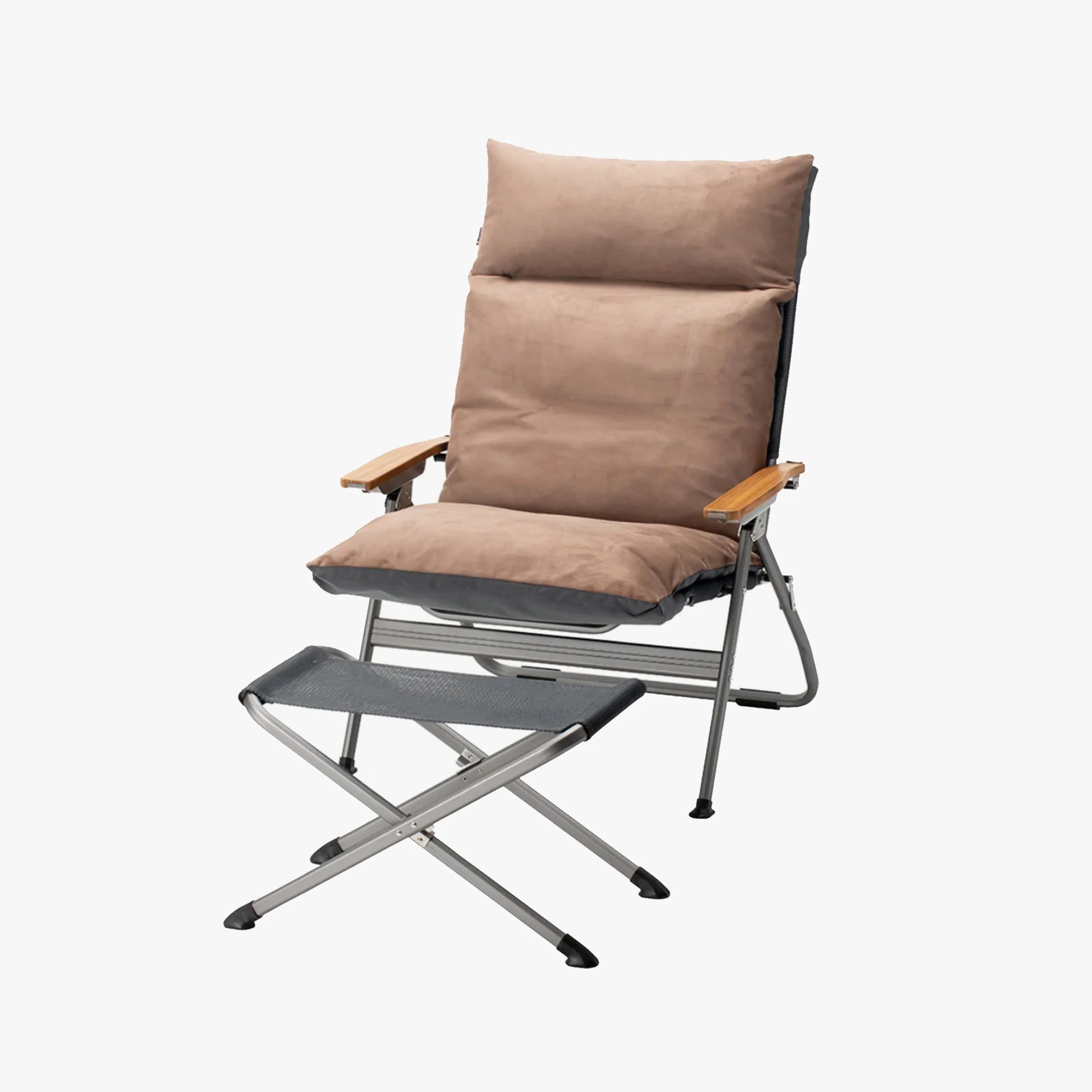 A cushioned lounge chair with a high backrest and padded seat in a light brown fabric. The chair has wooden armrests and a metal frame. In front of the chair is a matching footrest with a metal frame and a black fabric top.