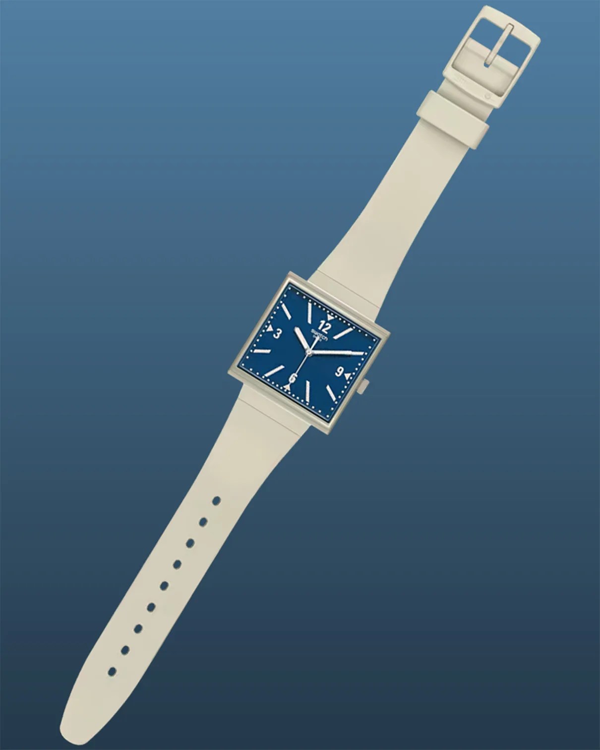 Square-faced wristwatch with a blue dial, white hour markers, and white hands, including a second hand. The watch has a white strap with a buckle closure. The background is a gradient of blue shades.